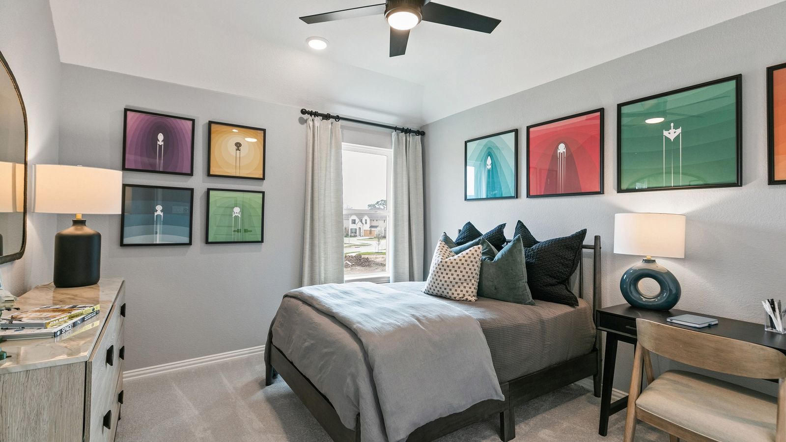 Luxurious bedroom design with contemporary wall art and sleek fan at Park at Eldridge.