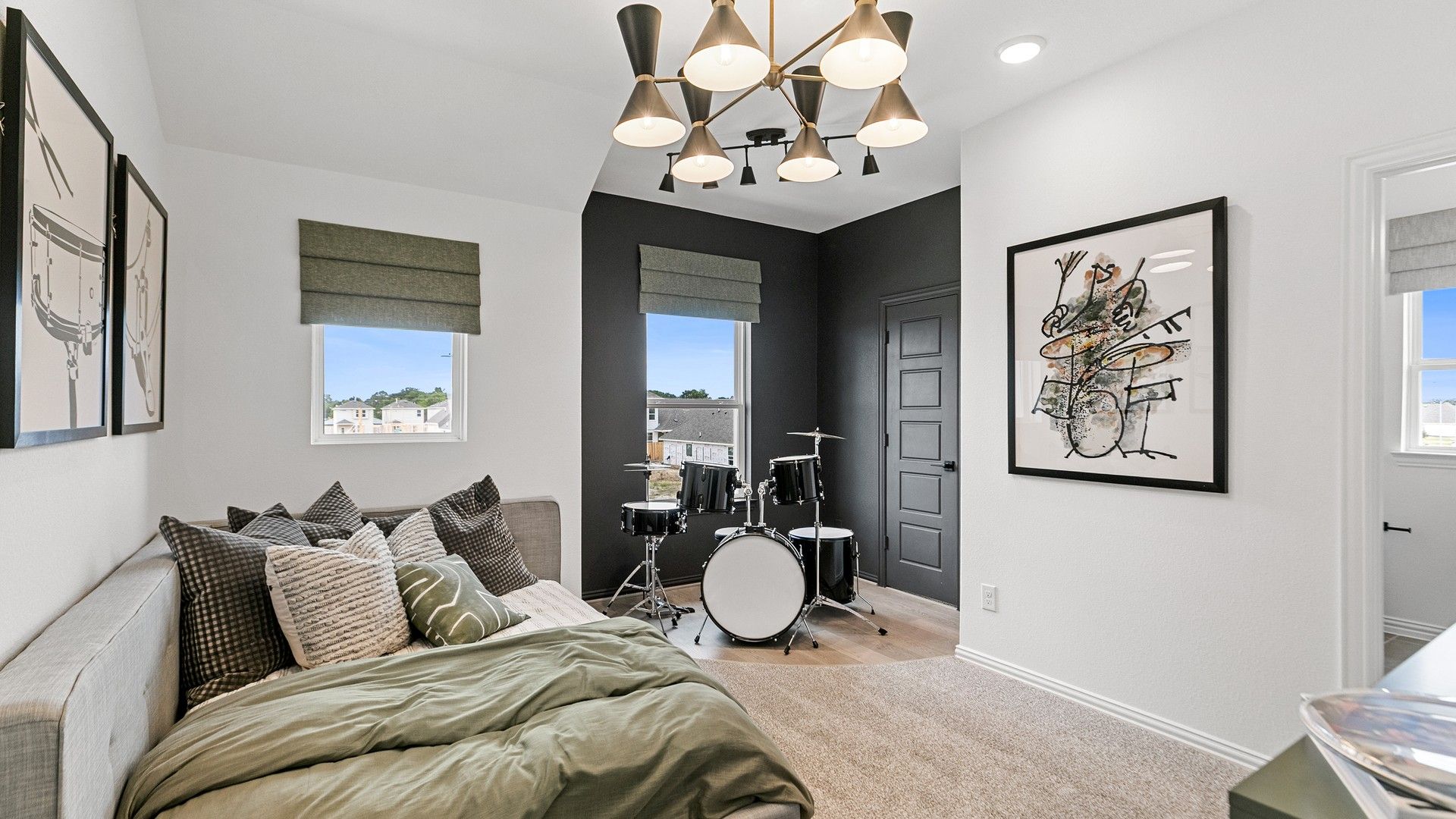 Experience premium design in Beamer Villas with chic gray walls, luxe bedding, and a modern lighting fixture.