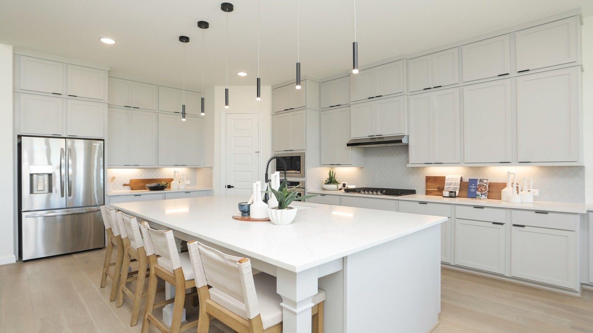 Luxurious Brookewater kitchen boasts a marble island, elegant cabinetry, and top-tier fixtures.