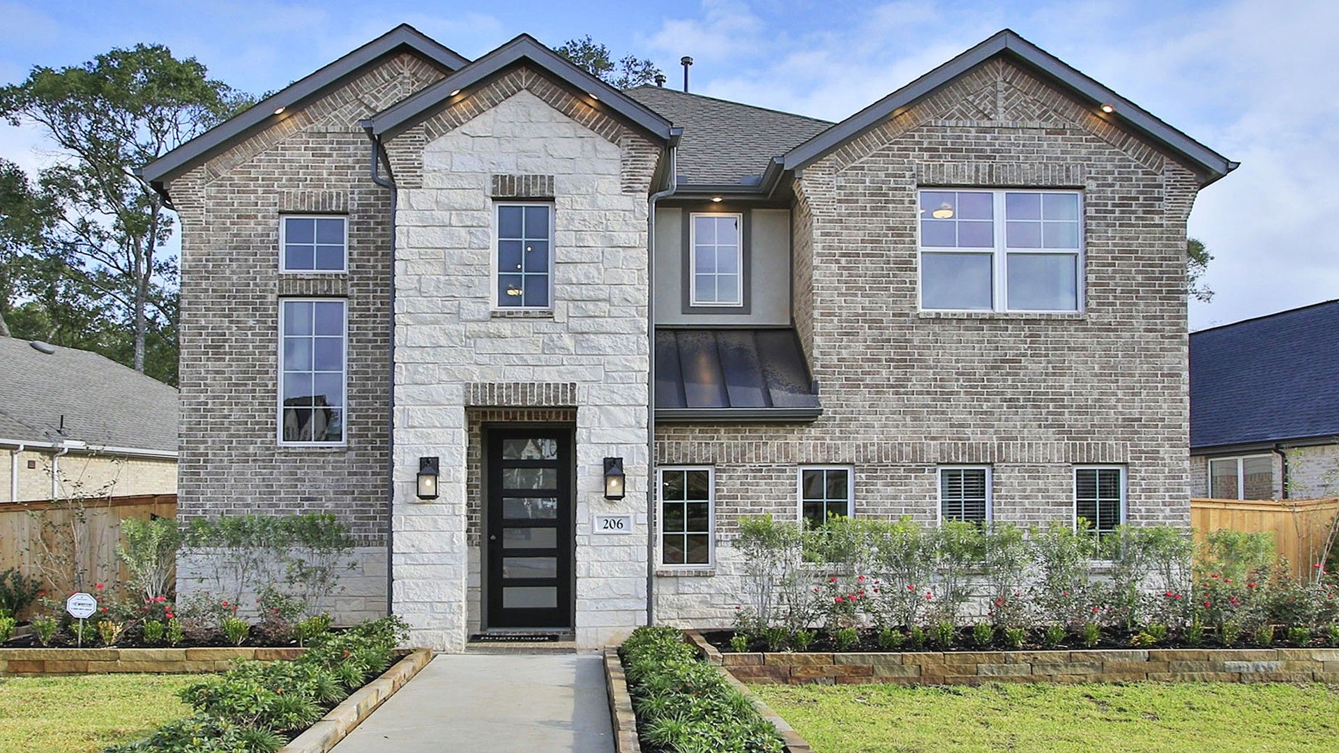 Elegantly designed with a striking stone facade, this Woodlands Hills home offers luxury and modern sophistication.