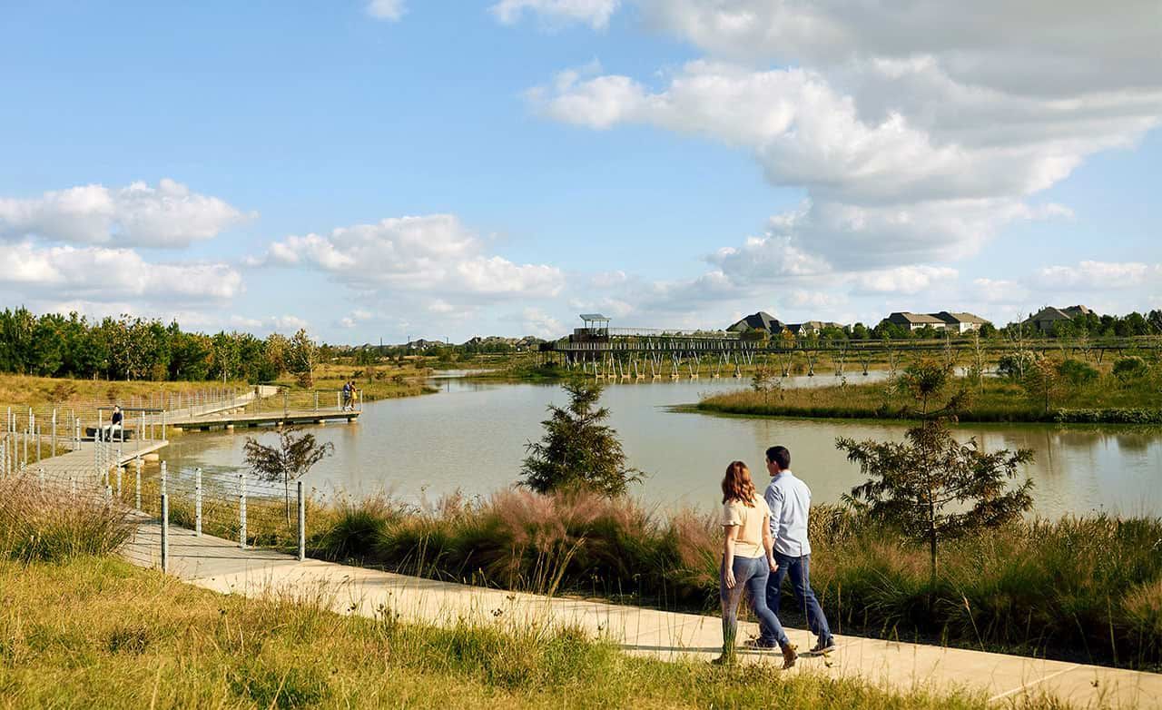 Stroll through Bridgeland's elegant wooden walkway, blending nature with modern elegance in a tranquil setting.