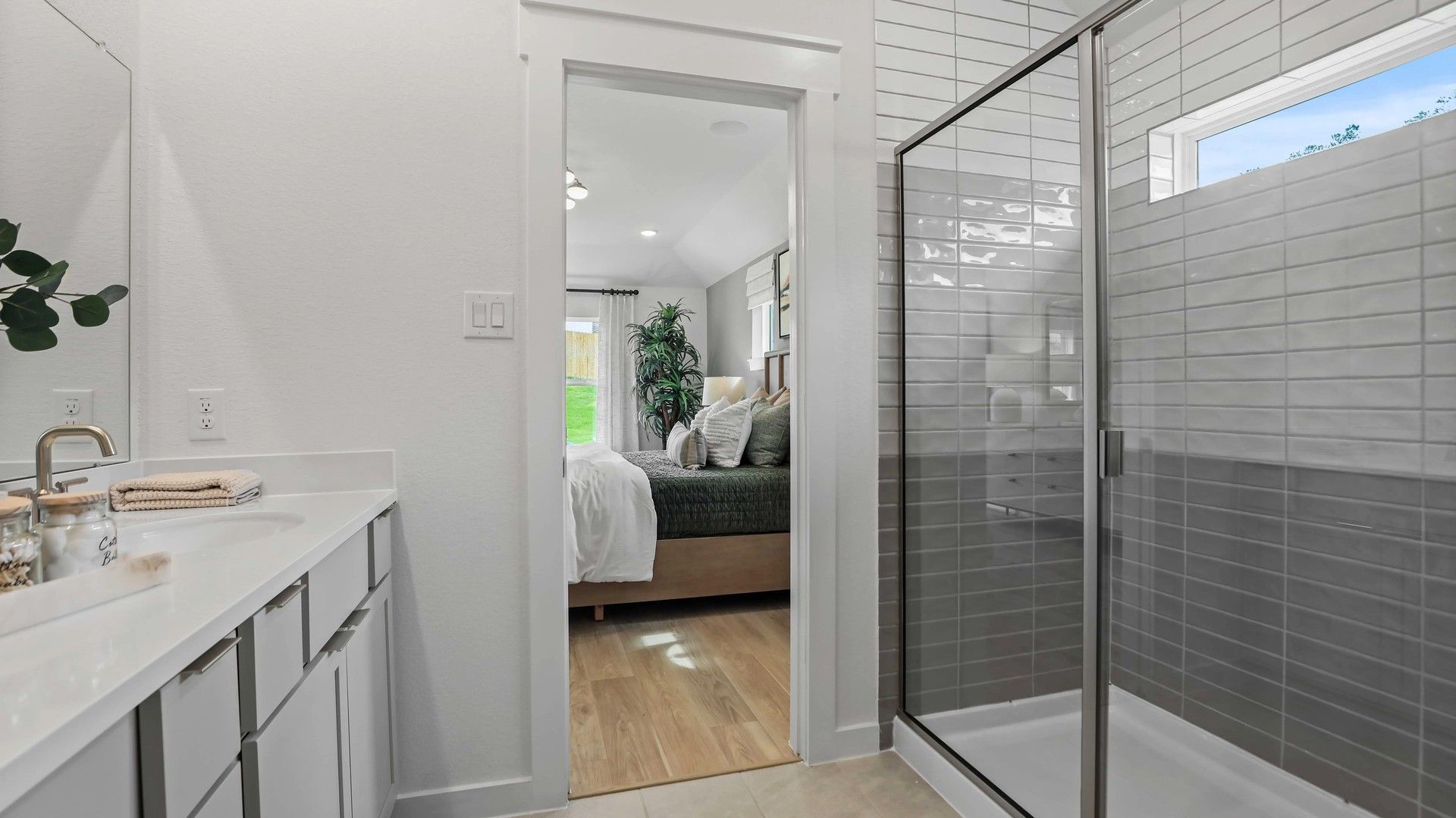Elegant glass shower and sleek vanity define luxury in Mostyn Springs.