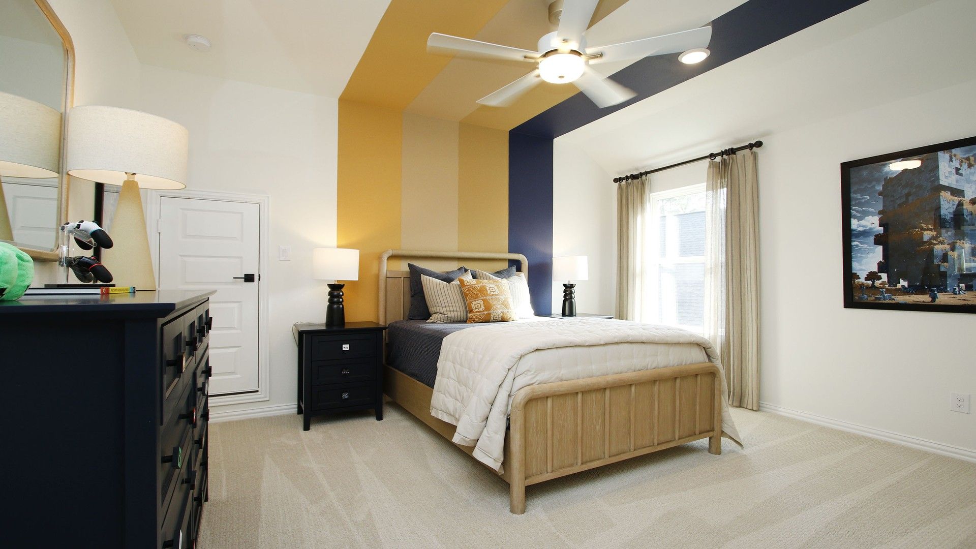 Luxurious bedroom features striking striped accent wall and plush furnishings in The Woodlands Hills, Texas.