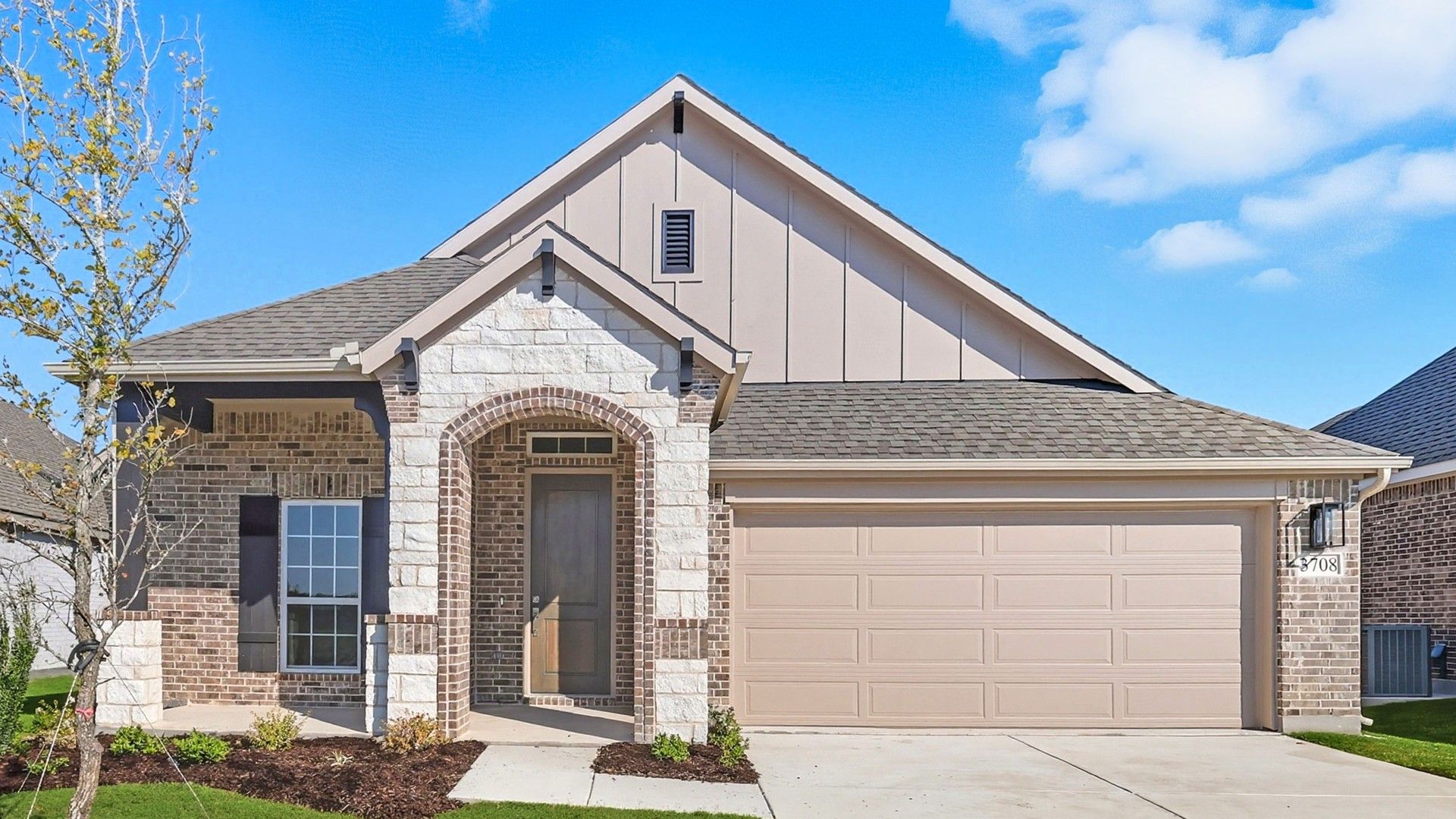 Elegant brick and stone facade enhances this Churchill home at 3708 Pitchfork Terrace.