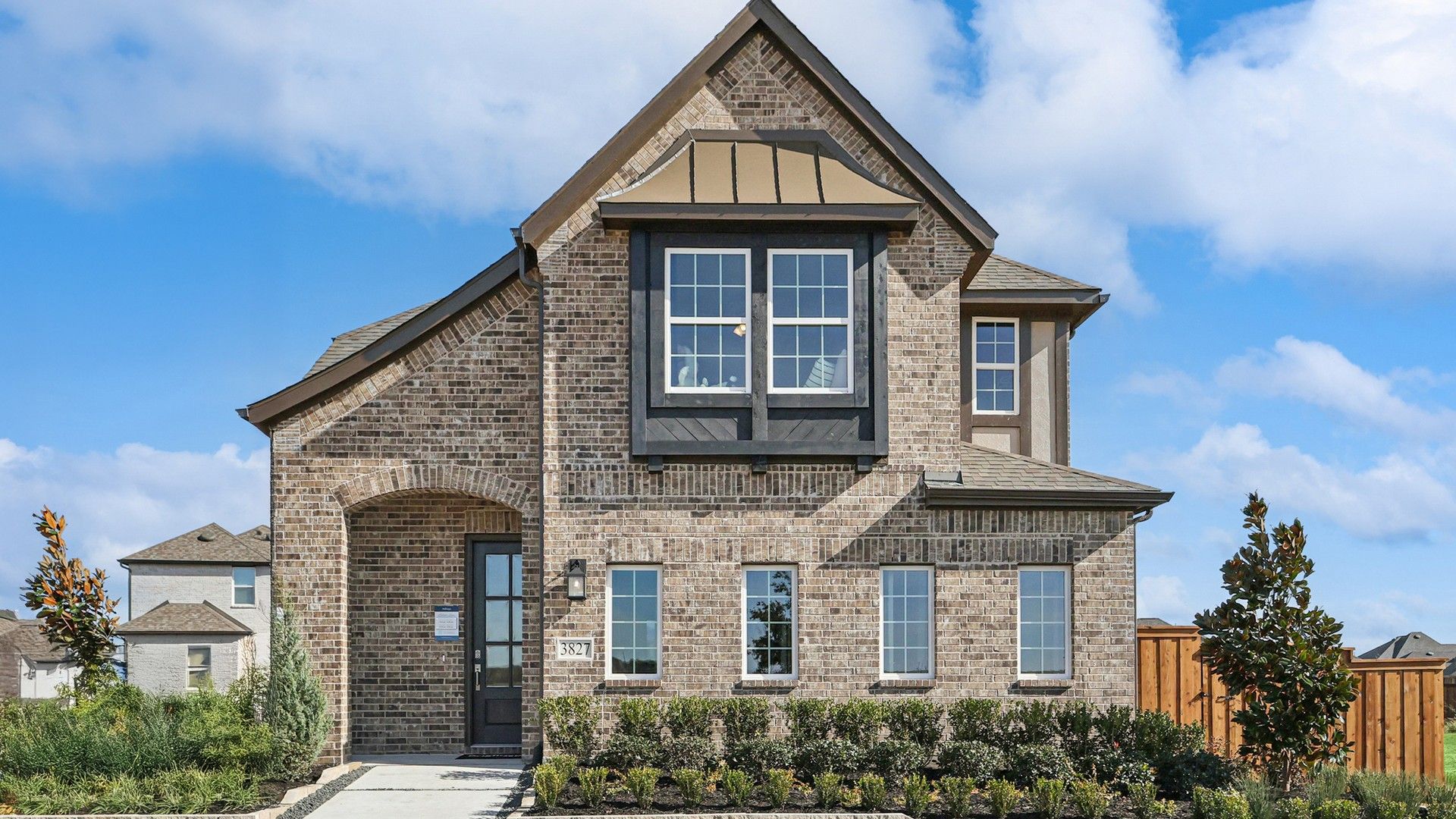 Experience refined living in Bel Air Village with this stately brick facade and meticulously landscaped grounds.