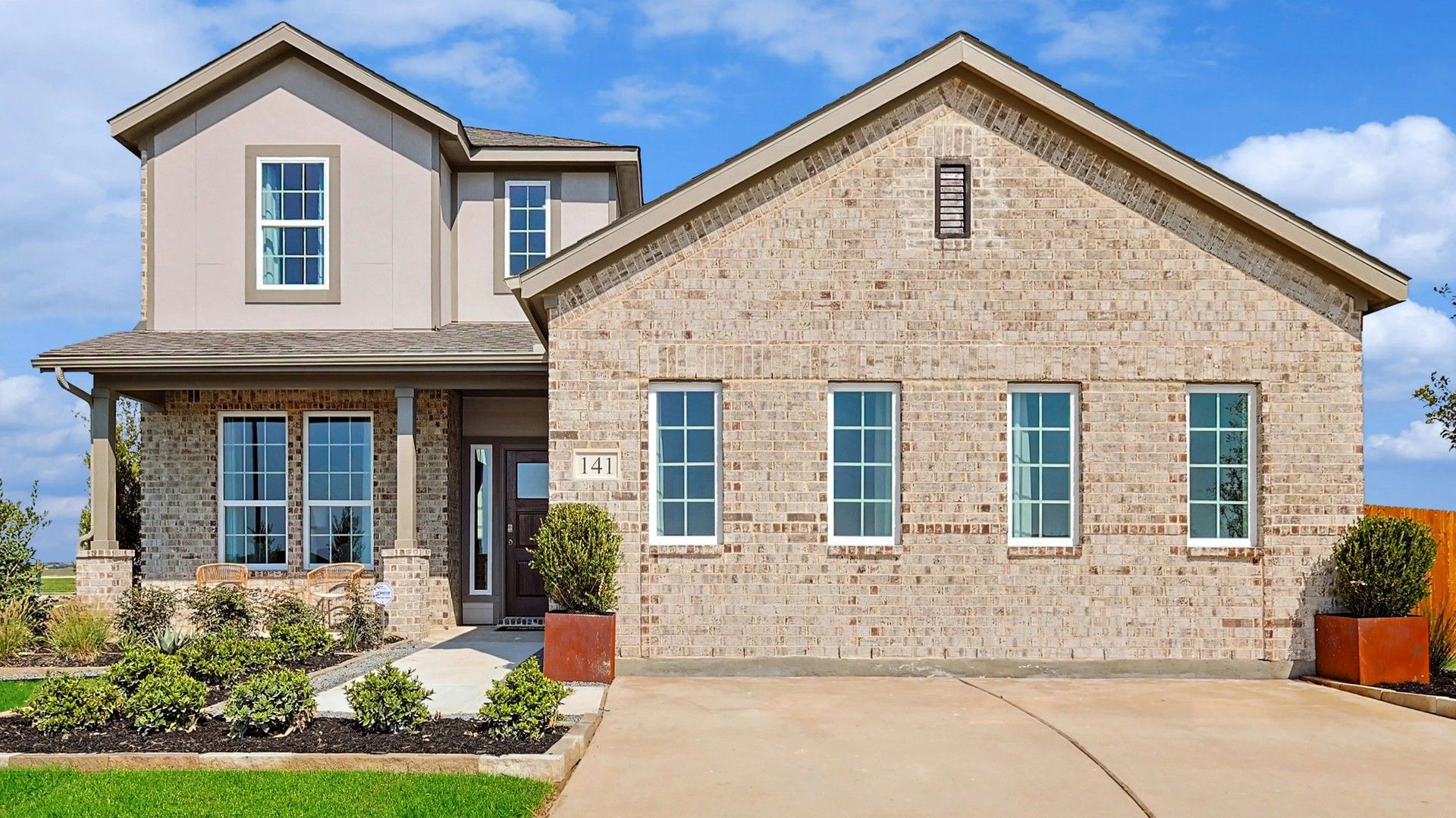 Luxurious brick facade and spacious windows define this Patriot Estates residence, Texas.