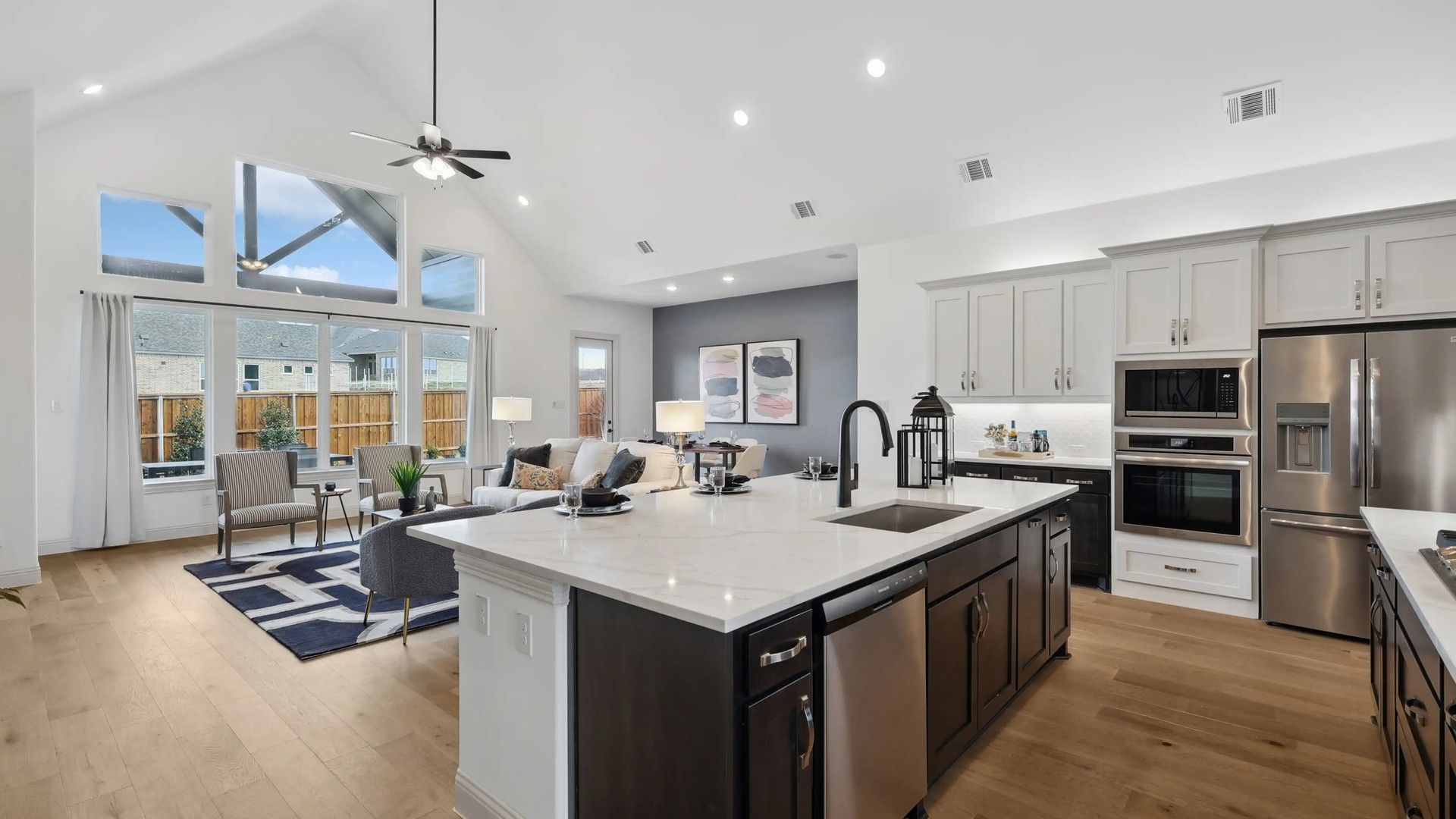 Expansive living space with vaulted ceilings, premium finishes, and abundant light in Westside Preserve.