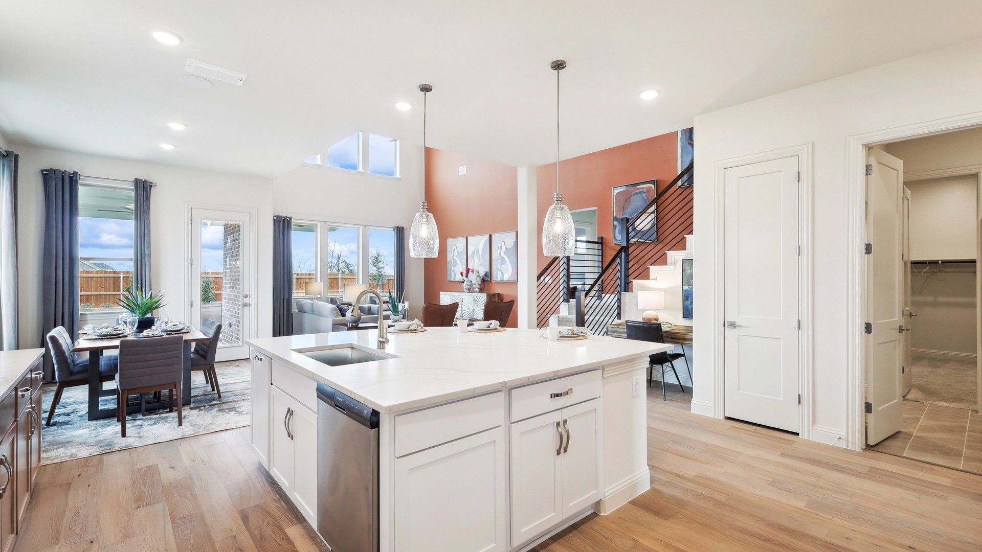 Experience bespoke elegance with a quartz-topped island and luxurious hardwood flooring in The Oaks.