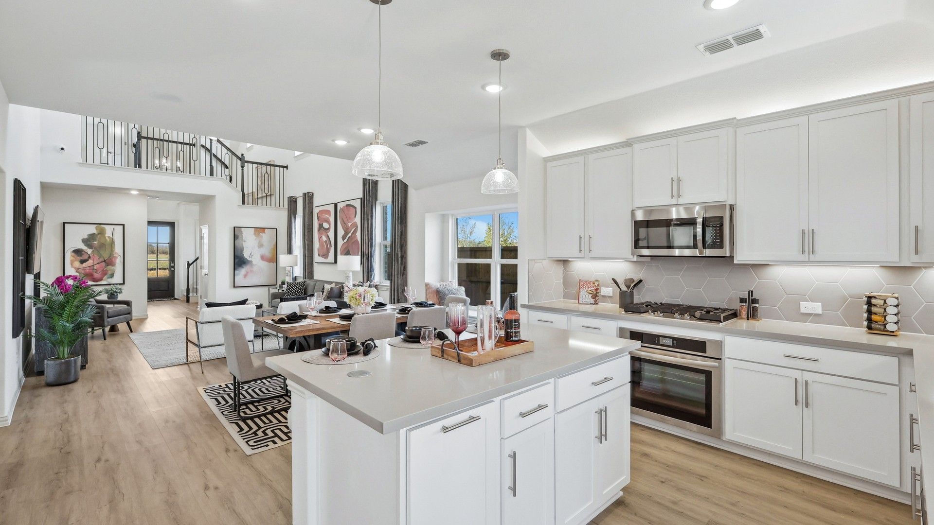 Experience sophisticated open-living with elegant cabinetry and sleek finishes in Bel Air Village's luxury kitchen.