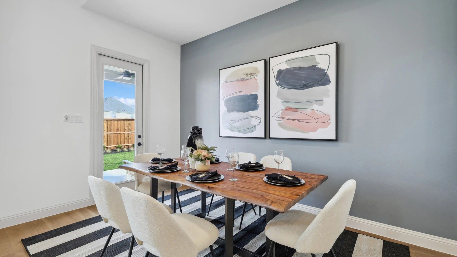 Westside Preserve features a chic dining room with a sleek wood table and modern art accents.
