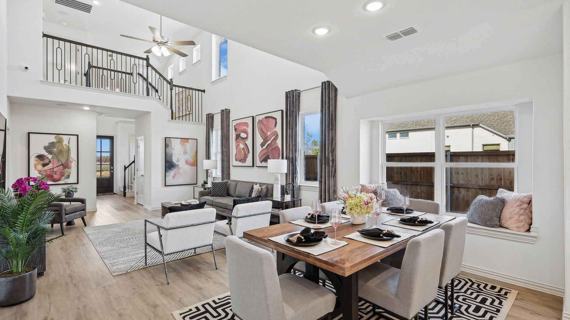 Revel in high ceilings and expansive windows in Bel Air Village's exquisite living-dining space.