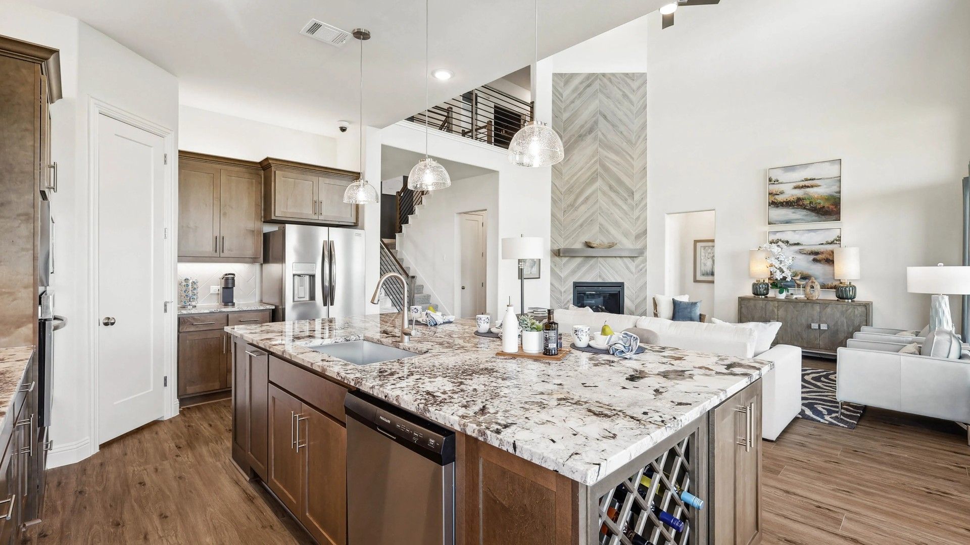 Elegant marble island and premium wood flooring define this Ridge Crossing kitchen space.