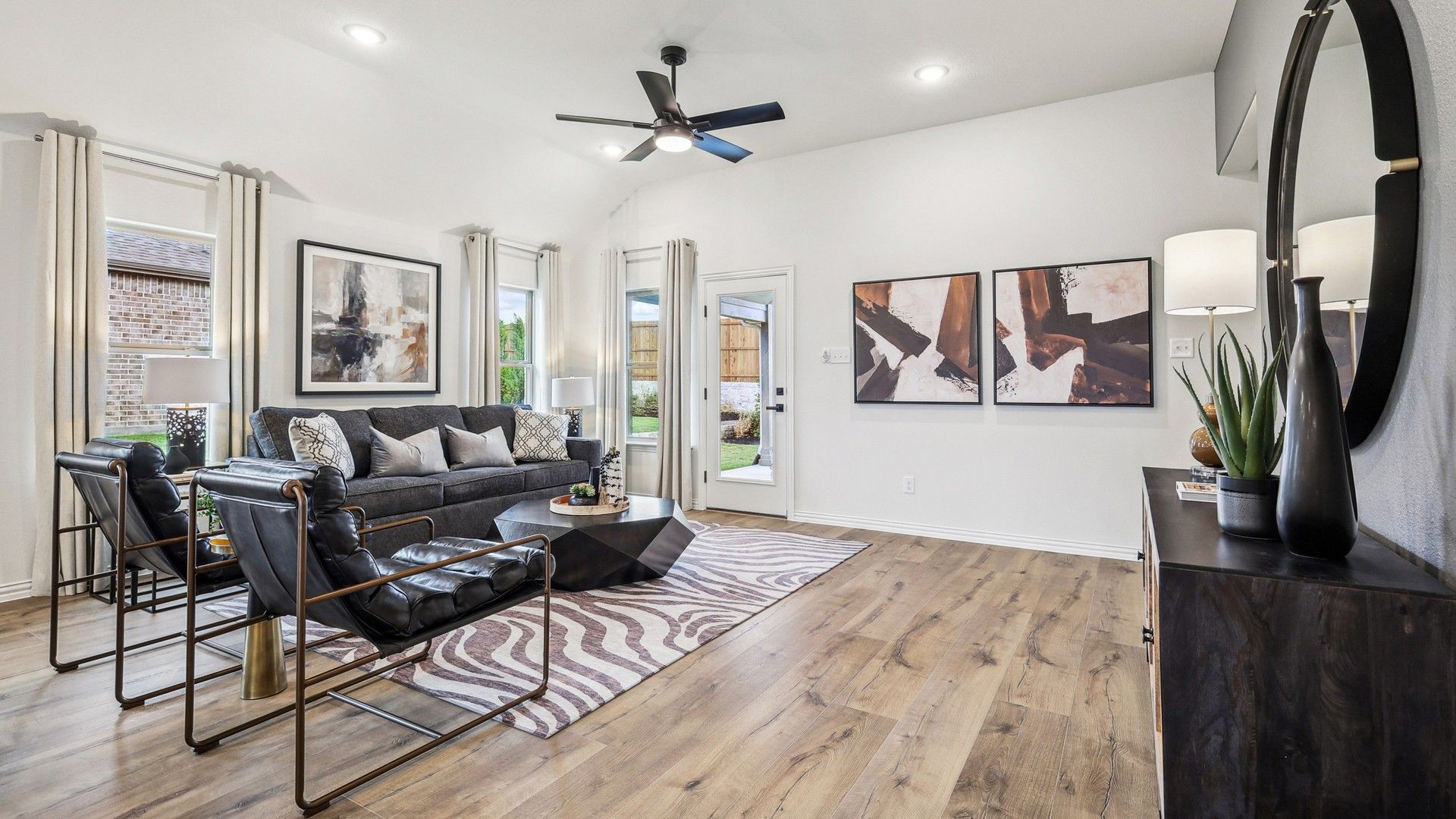 Impeccable wood floors and sleek, modern decor enhance the luxury of this Churchill living space.