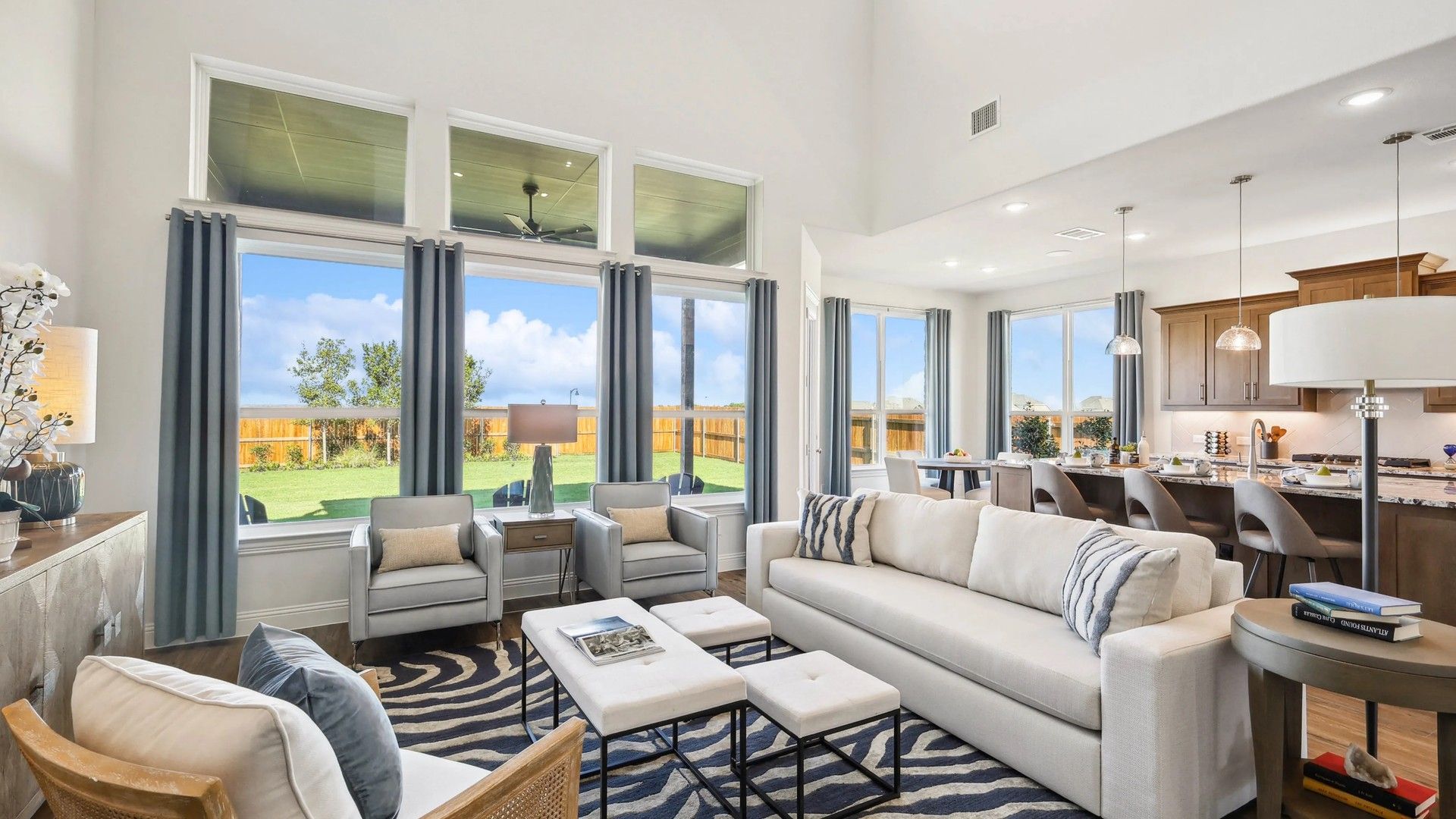 Experience Ridge Crossing's expansive living area with soaring ceilings and elegant flooring, perfect for upscale living.