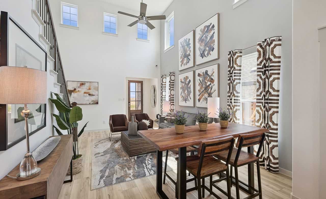 Experience luxury with high ceilings, abstract art, and elegant wood finishes in Walden Pond community.