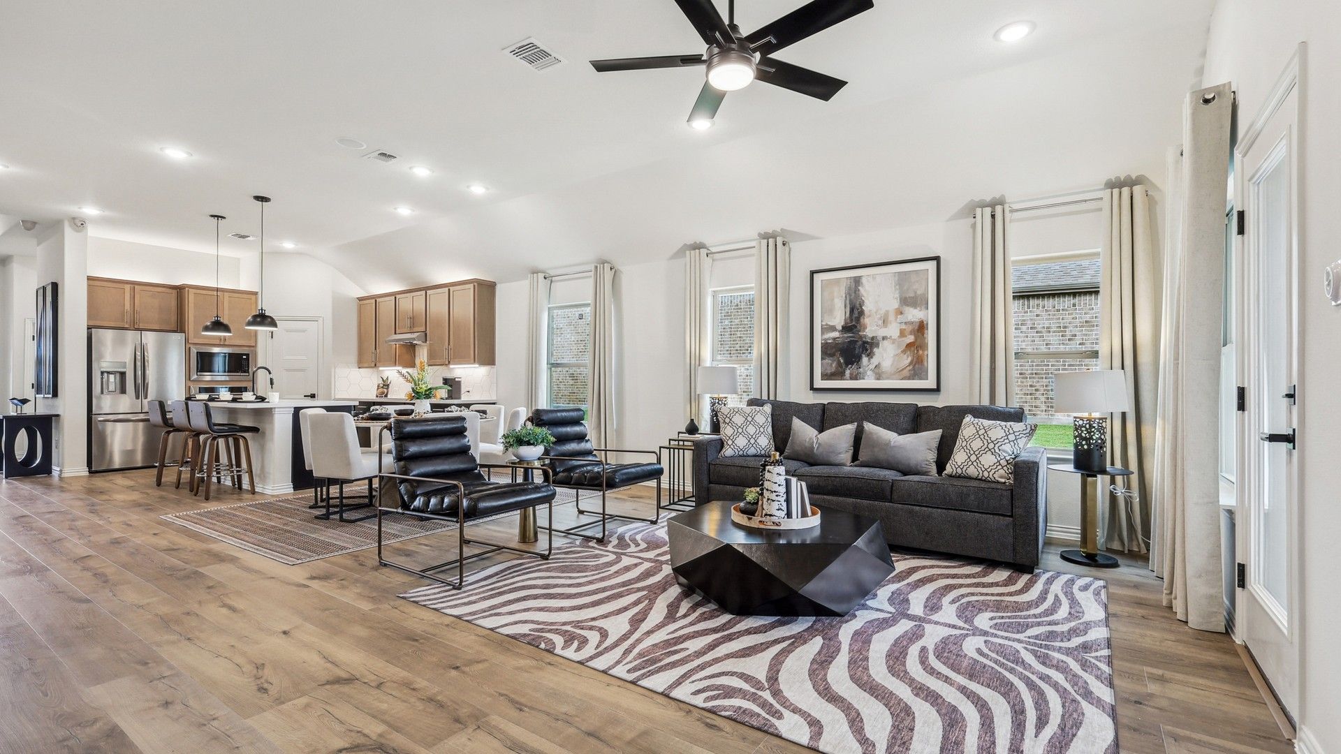 Experience luxury with wood floors, geometric furniture, and sleek design in Churchill's refined living space.