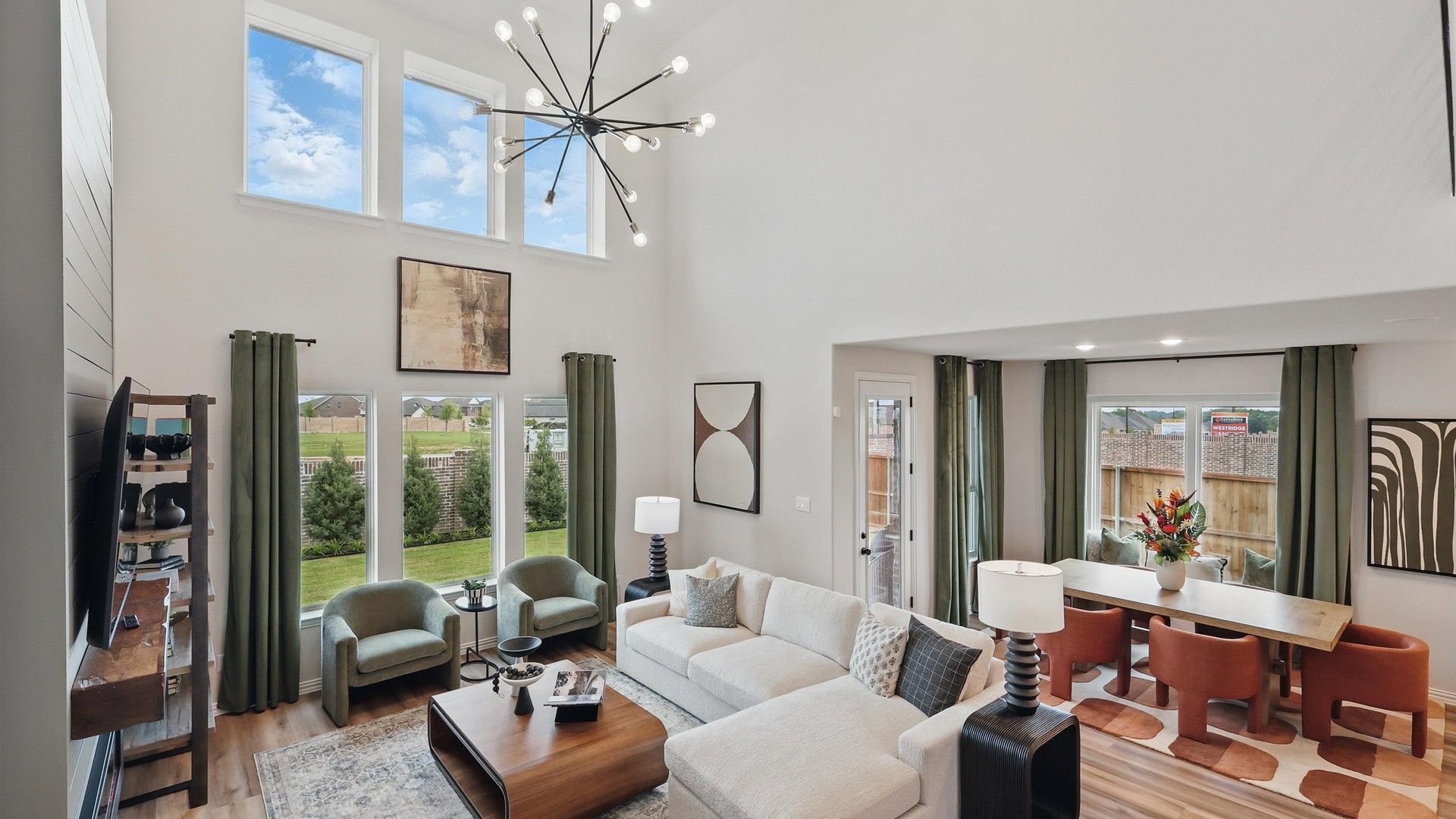 Experience elegance with expansive windows, high ceilings, and a striking chandelier in Westridge.