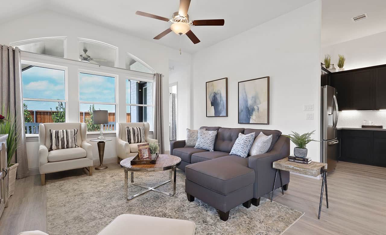 Featuring vaulted ceilings and expansive windows, this Thompson Farms home defines sophisticated elegance.