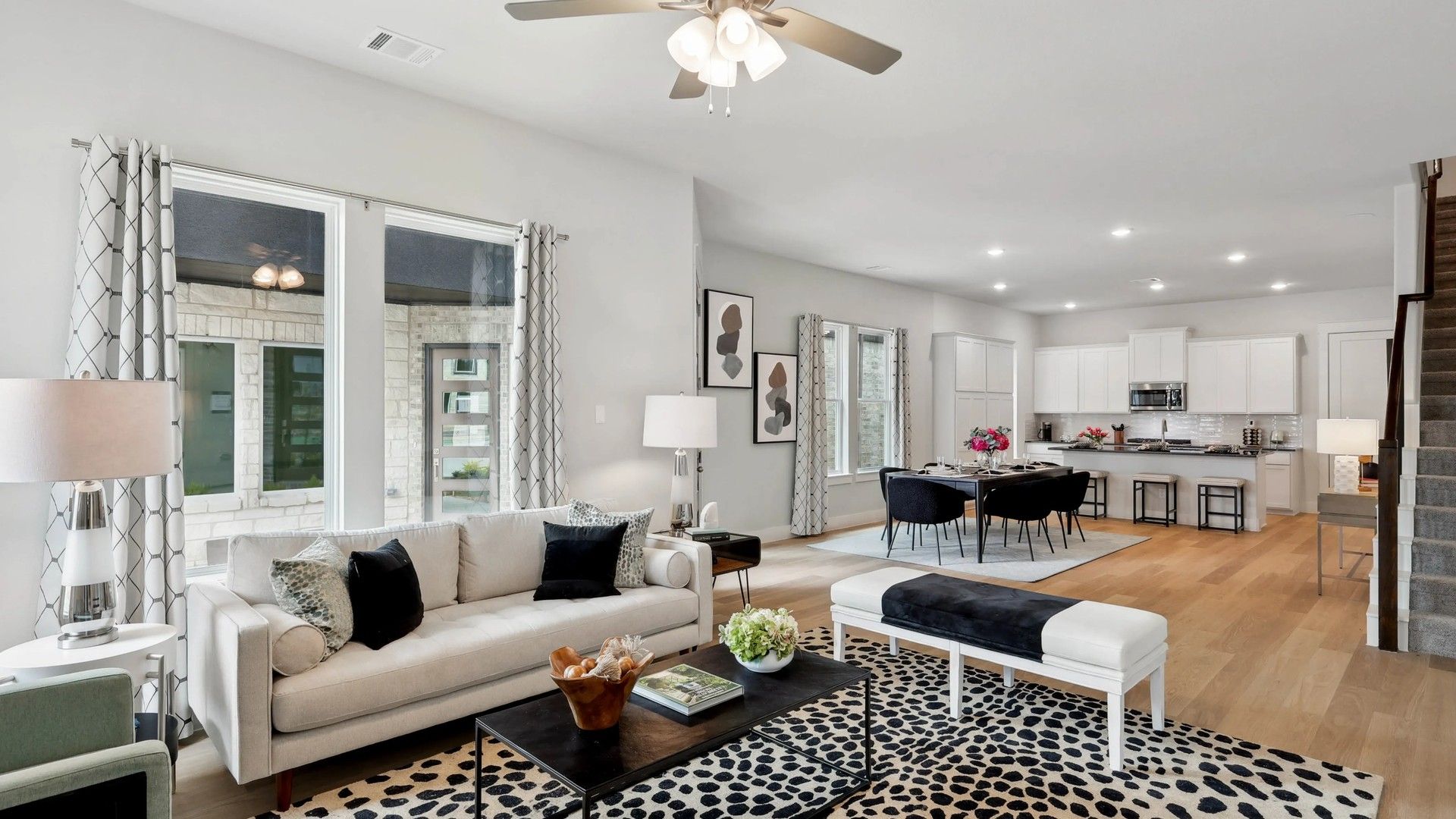 Luxurious open-plan design features upscale finishes and chic decor, creating refined elegance in Collin Creek.