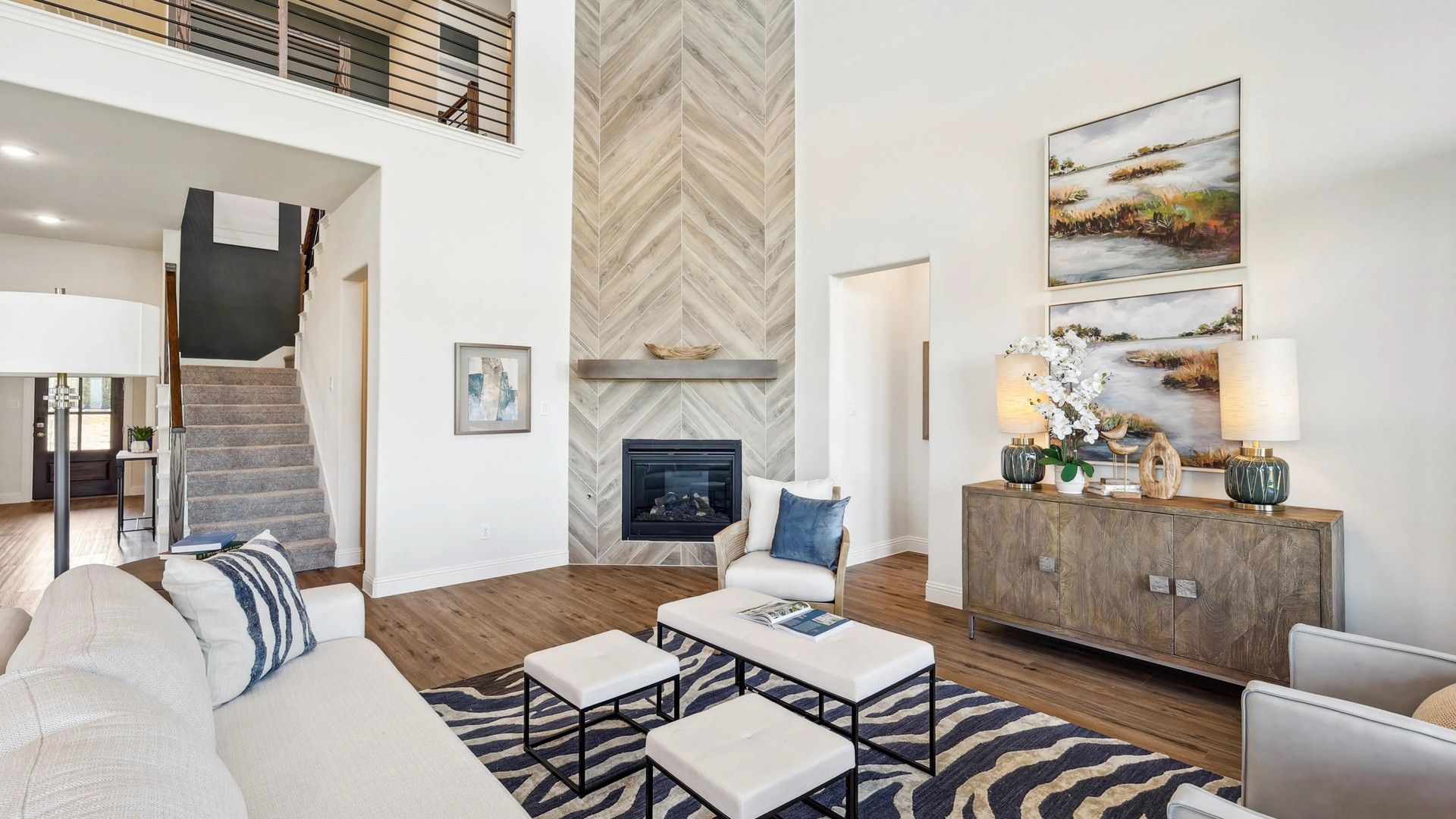 Luxurious Ridge Crossing living space with herringbone fireplace, vaulted ceiling, and chic design elements.