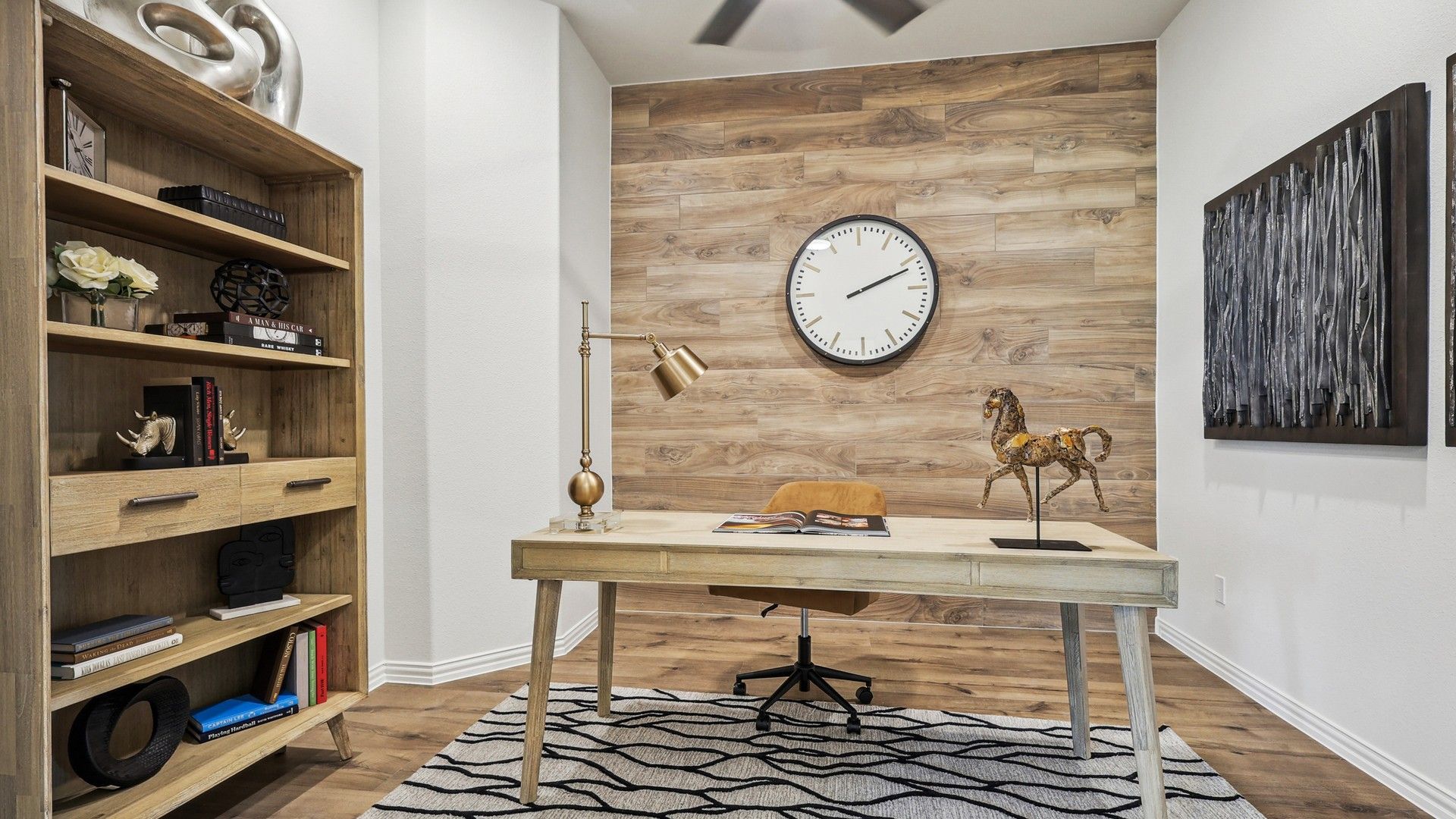 Refined Churchill office features a rich wood accent wall and exquisite modern decor. Luxurious and inviting.