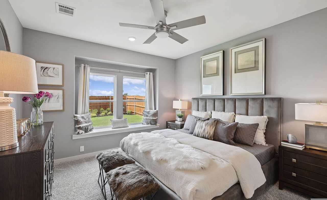 Plush upholstered bed, large windows, and modern finishes in Walden Pond offer refined comfort.