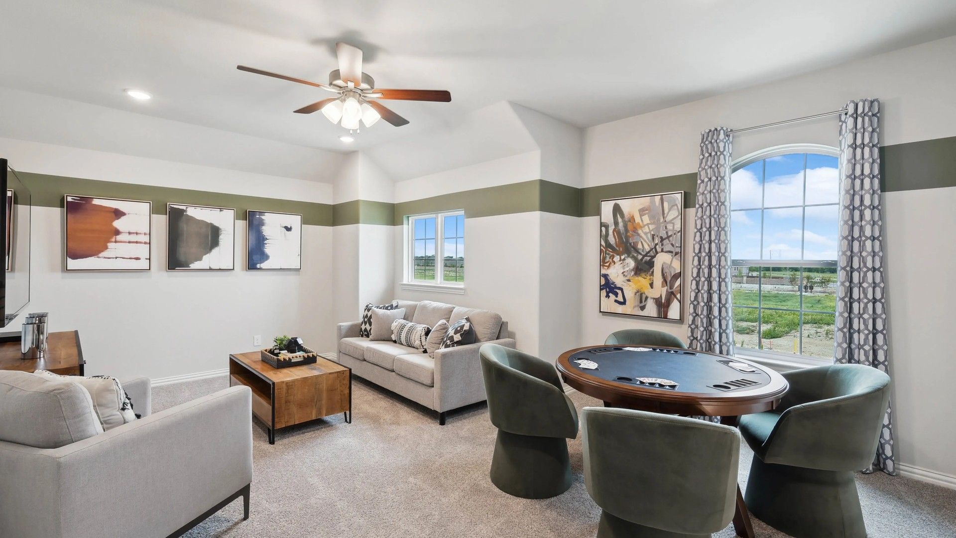 Sophisticated game room featuring plush seating, abstract artwork, and expansive views. Located in prestigious Hulen Trails.