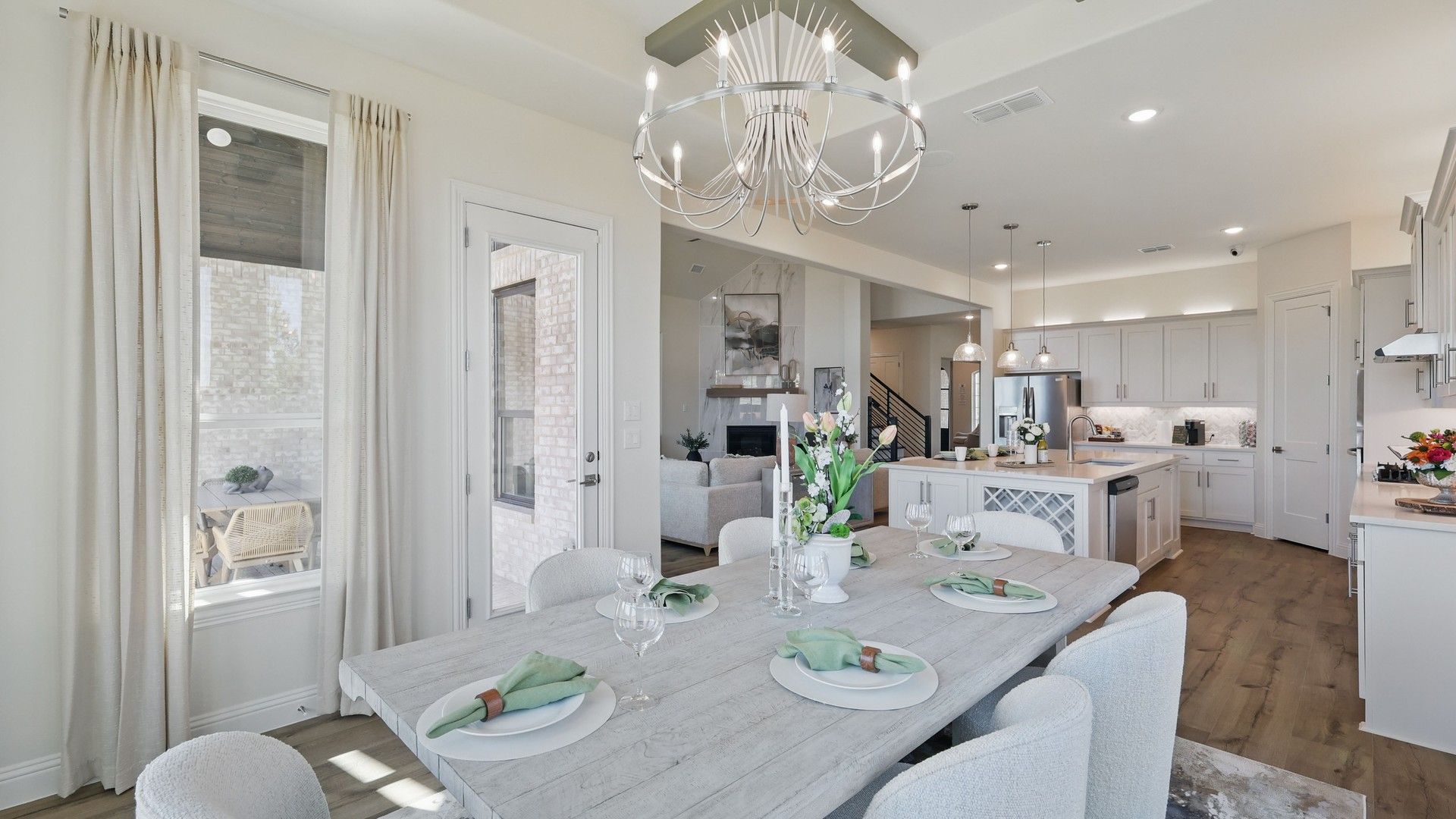 Experience refined living with a chic chandelier and gourmet kitchen, showcasing high-end finishes in Kelly Ranch.