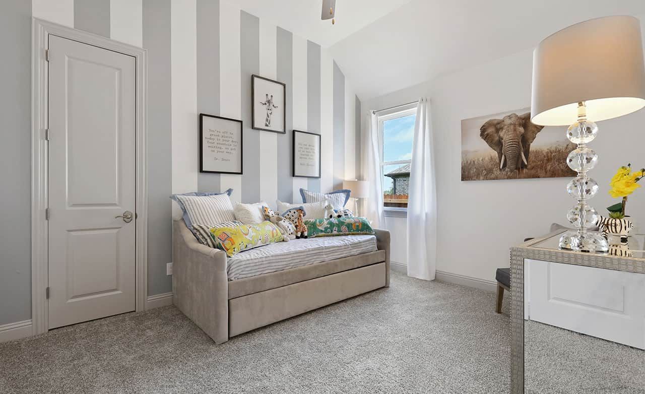 Luxurious kids' room featuring chic striped walls and plush textures in Thompson Farms.
