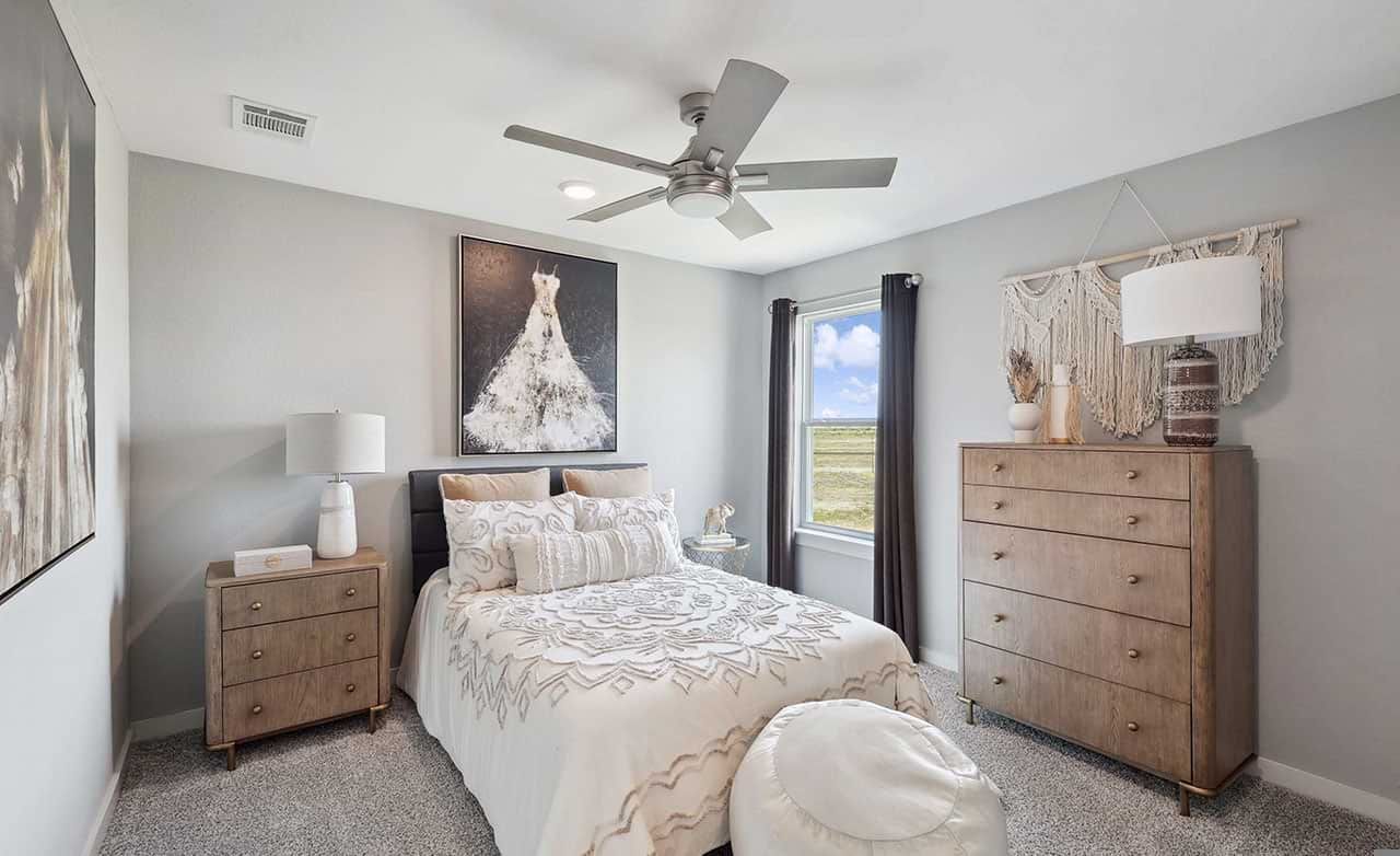 Luxurious bedroom with sleek furnishings, plush carpet, artistic decor in Walden Pond community.