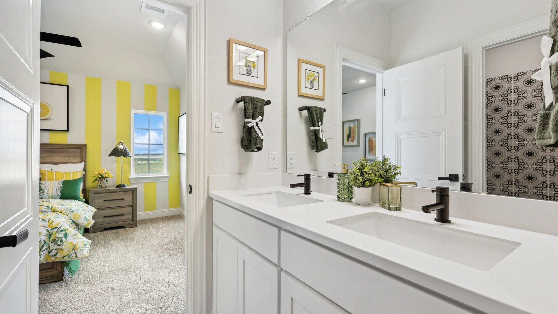 Luxurious dual sinks and elegant fixtures enhance this vibrant Green Meadows home.