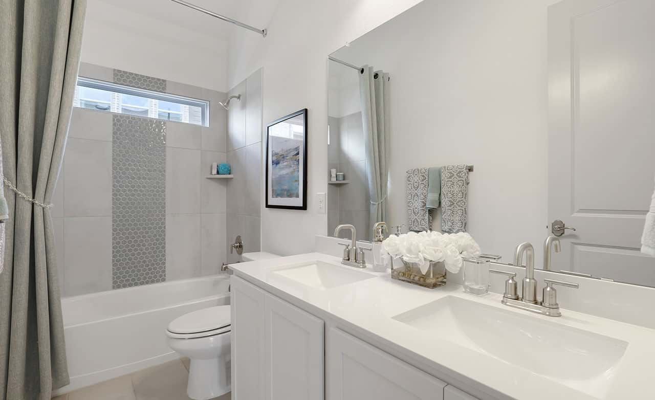 Experience serene luxury with dual sinks, premium fixtures, and chic tilework at Thompson Farms.