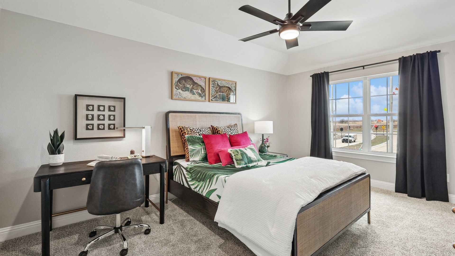 Spacious bedroom with luxe tropical bedding, sleek furnishings, and expansive window–Green Meadows.