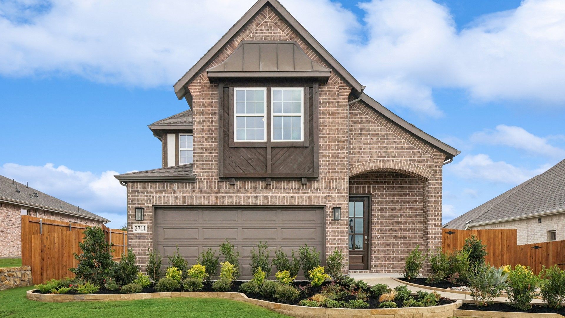 Experience refined elegance with this brick facade and gable roof in prestigious Churchill.