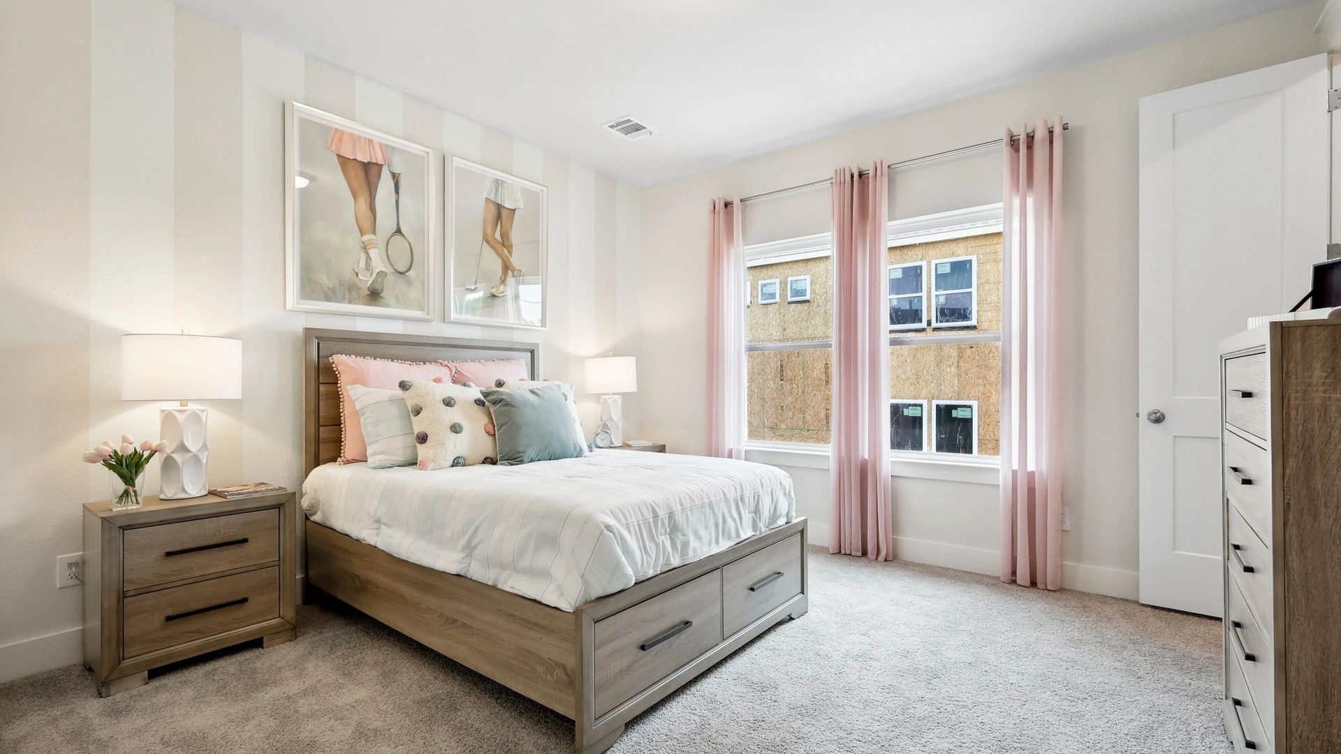Indulge in this chic bedroom featuring plush carpeting, soft hues, and ample natural light in Collin Creek.