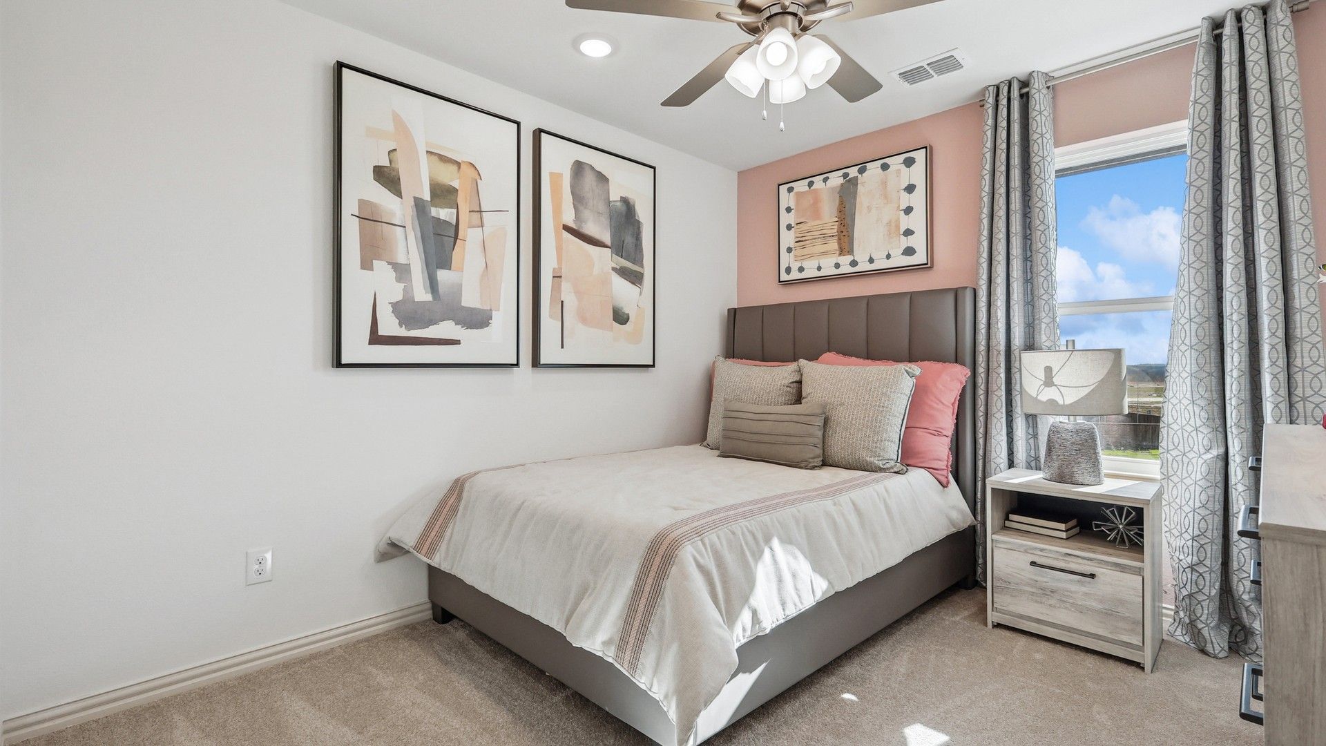 Sophisticated bedroom features abstract art, luxe textiles, and serene views in Bel Air Village.