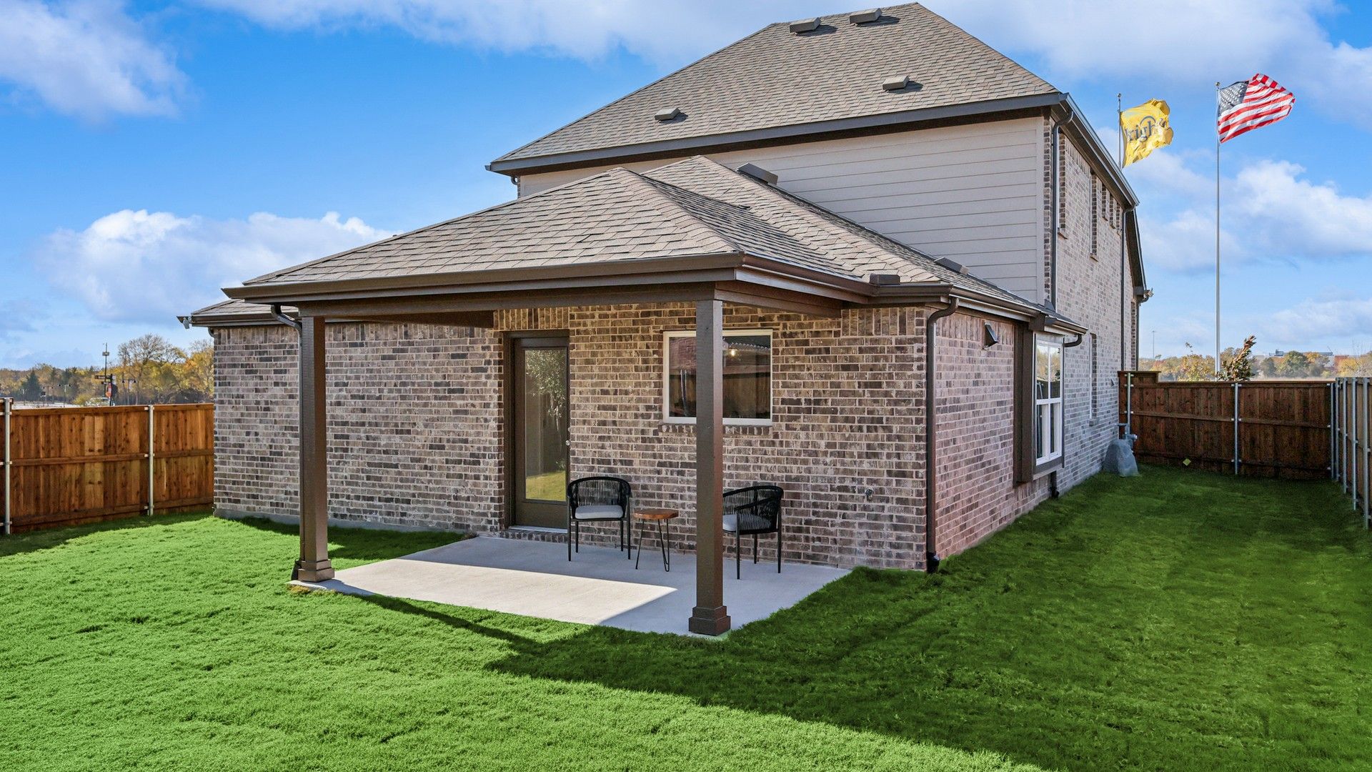 Exquisite brickwork and a covered patio define this Bel Air Village home, offering refined outdoor living.