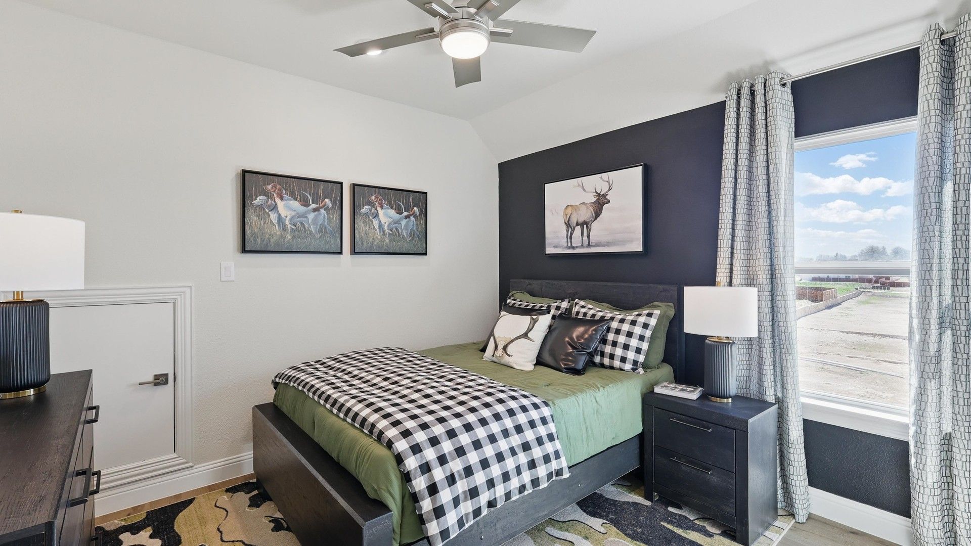 Elegant design featuring black accent wall and floor-to-ceiling window at Kelly Ranch's Rio Vista.