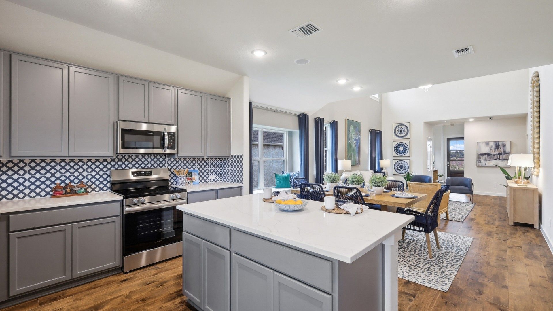 Experience refined living with gray cabinetry and exquisite backsplash in Churchill. Elegant and contemporary elegance.