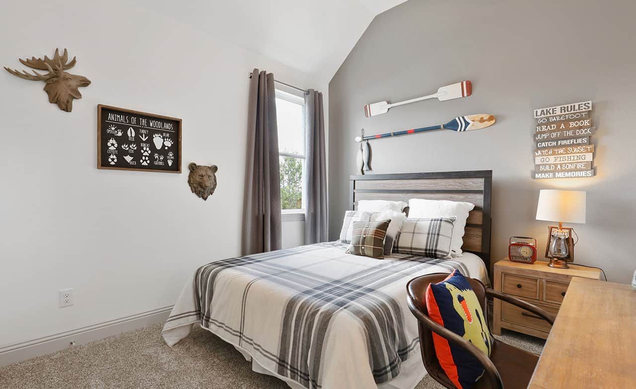 Experience rustic elegance with plaid bedding, wood accents, and animal motifs in Thompson Farms.