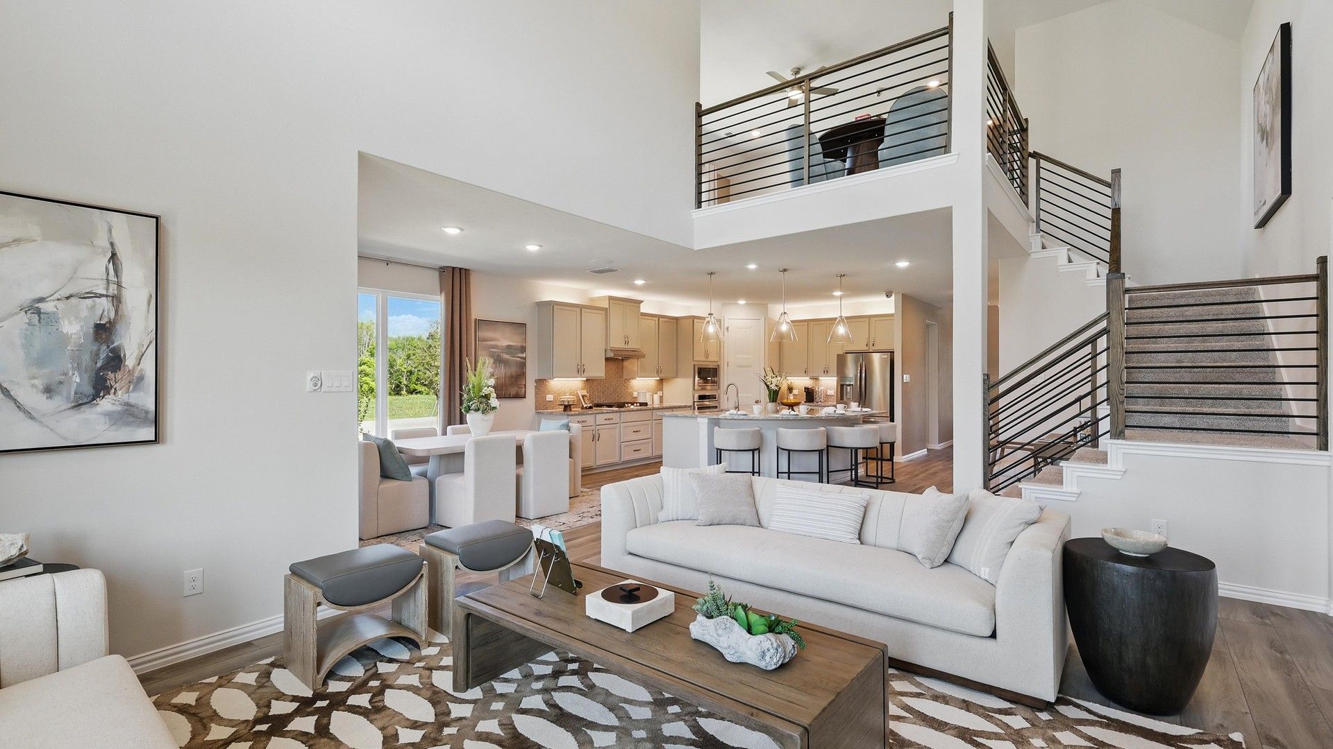 Experience modern elegance with a vaulted ceiling, open-plan kitchen, and chic staircase in Green Oaks Preserve.
