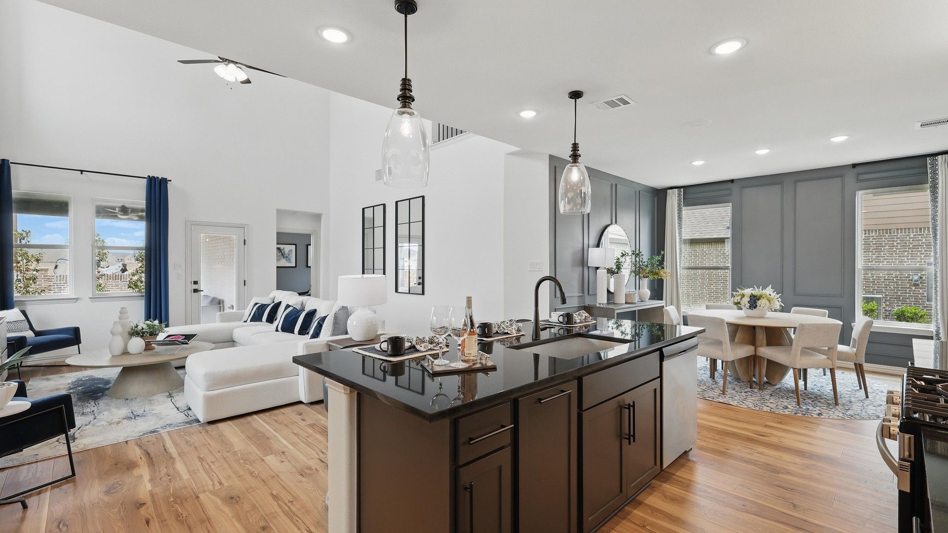 Exquisite open-concept design with high ceilings and luxurious wood floors in Westridge community.