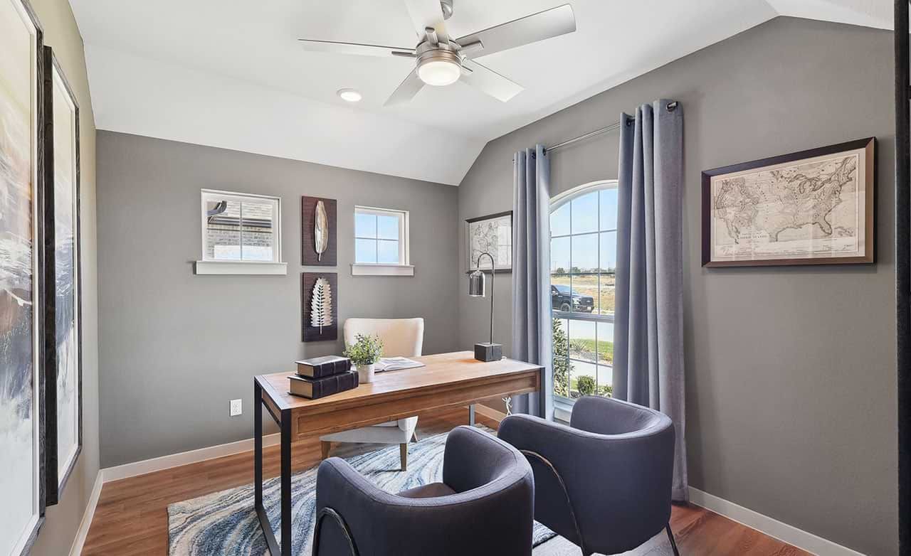 Elegant arched window and sophisticated decor elevate this Walden Pond home office.