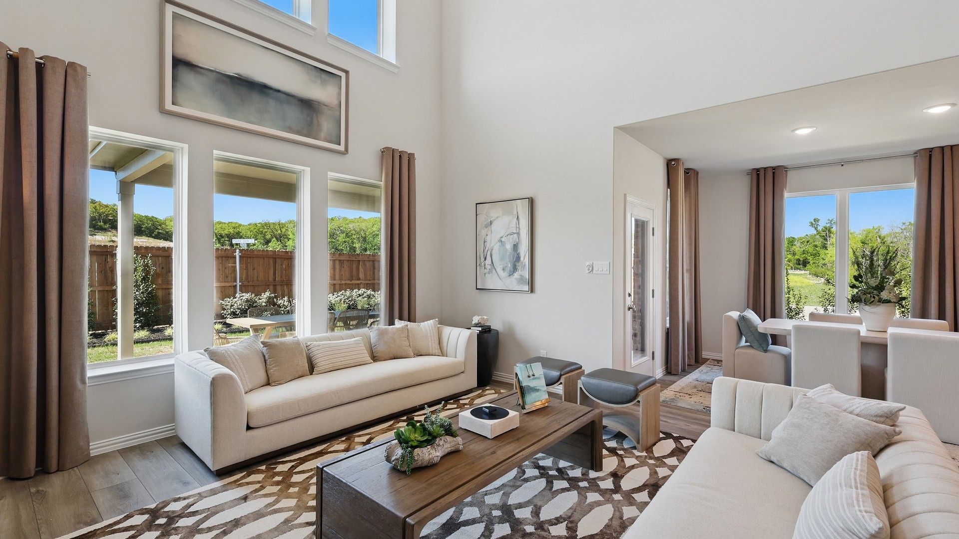 Experience elegance with high ceilings and abundant natural light in Green Oaks Preserve's refined interiors.