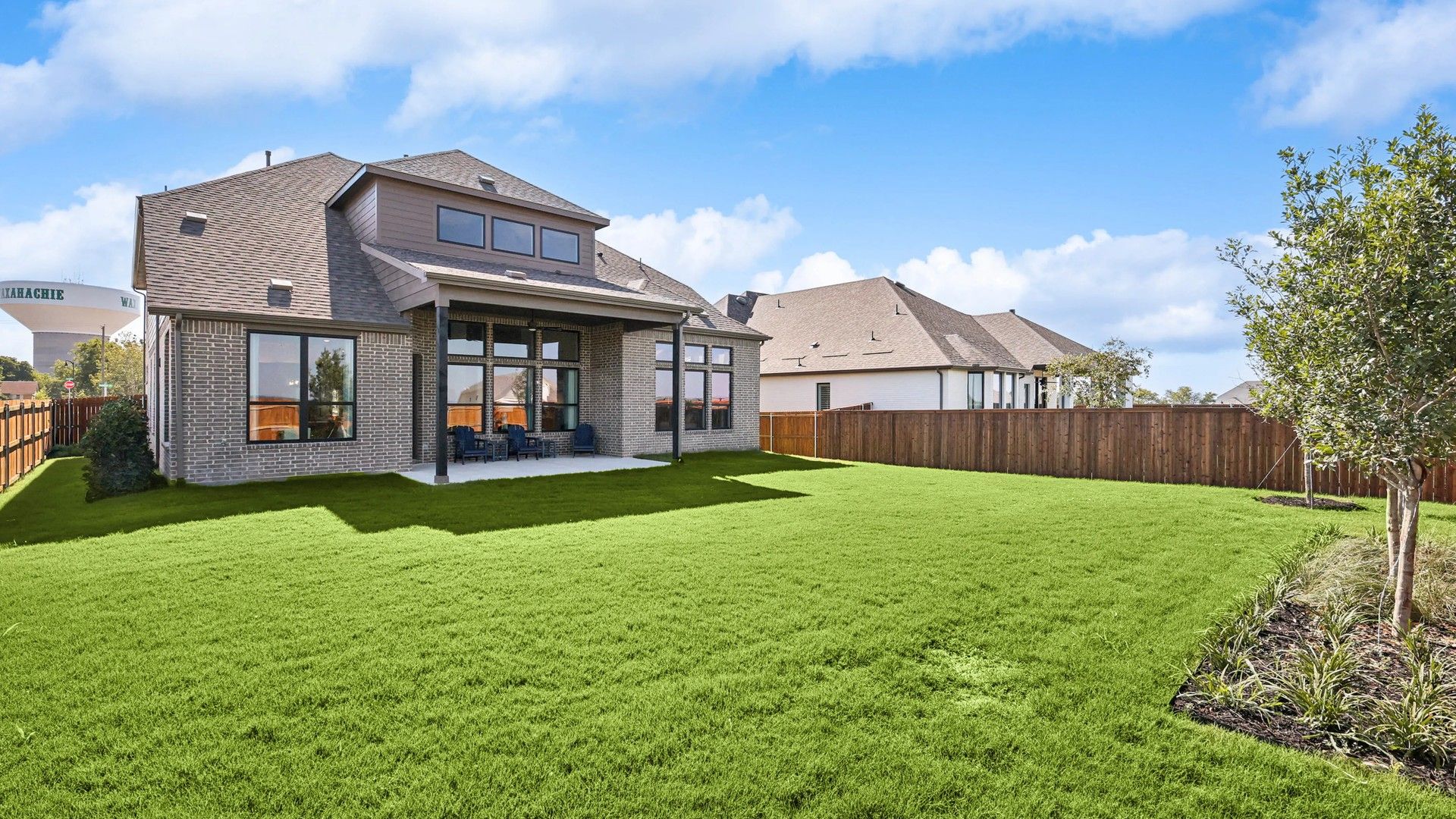 Experience elevated living in this brick masterpiece with a large verdant lawn in Waxahachie's Ridge Crossing.
