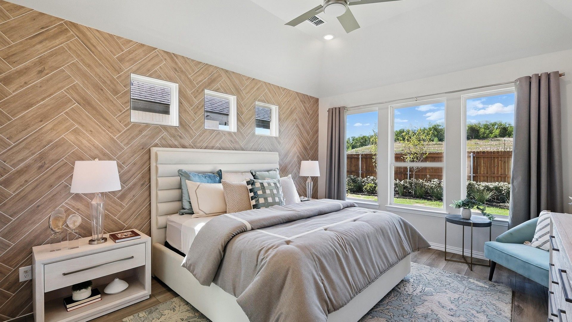 Revel in a chic herringbone accent wall and abundant natural light in Green Oaks Preserve.