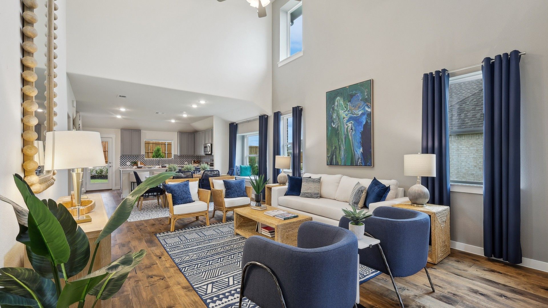 Experience elevated design with soaring ceilings and elegant wood flooring in Churchill's stylish living area.