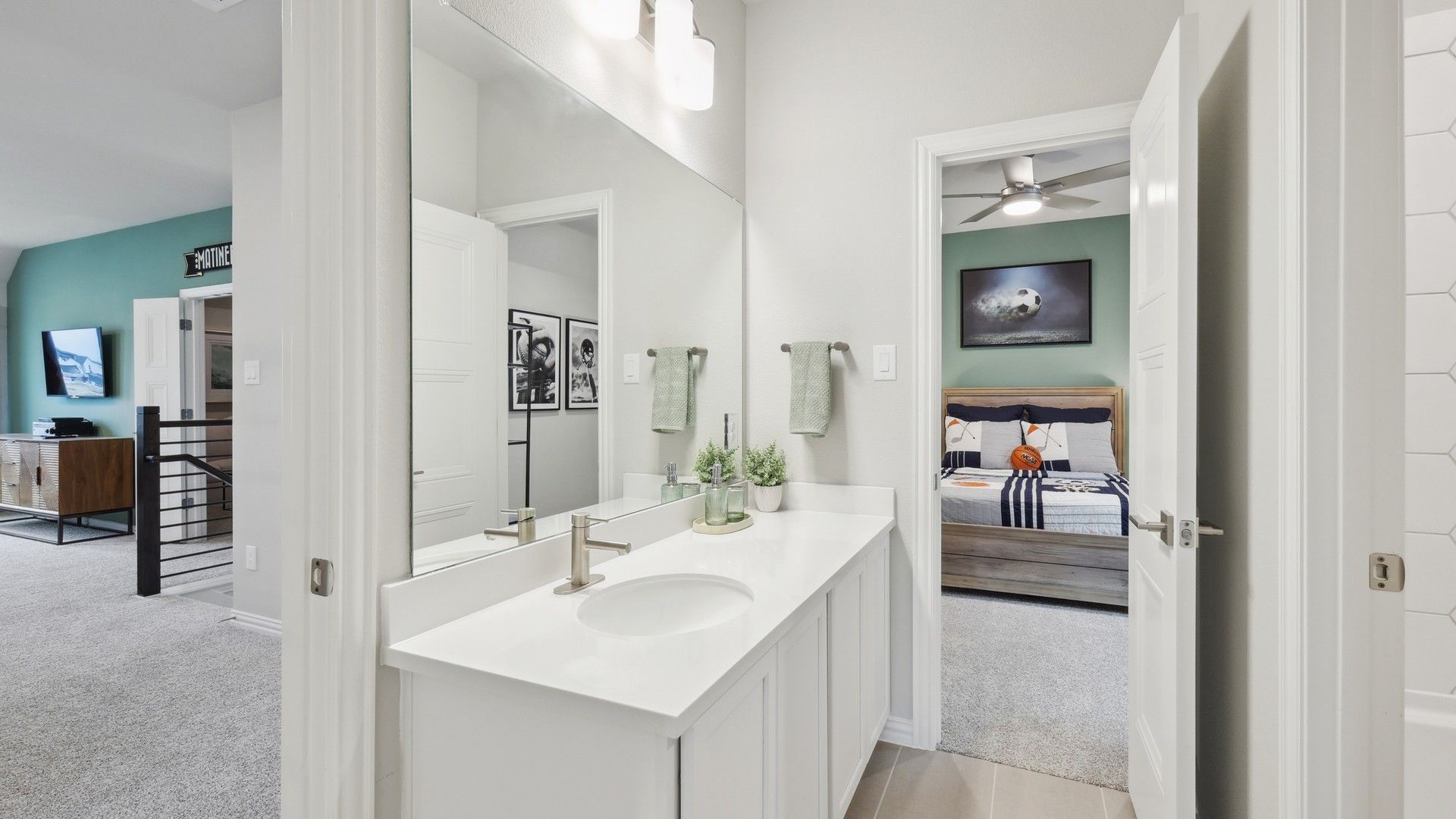 Luxurious white vanity and chic bedroom combine elegance and comfort in Wildflower Ranch.