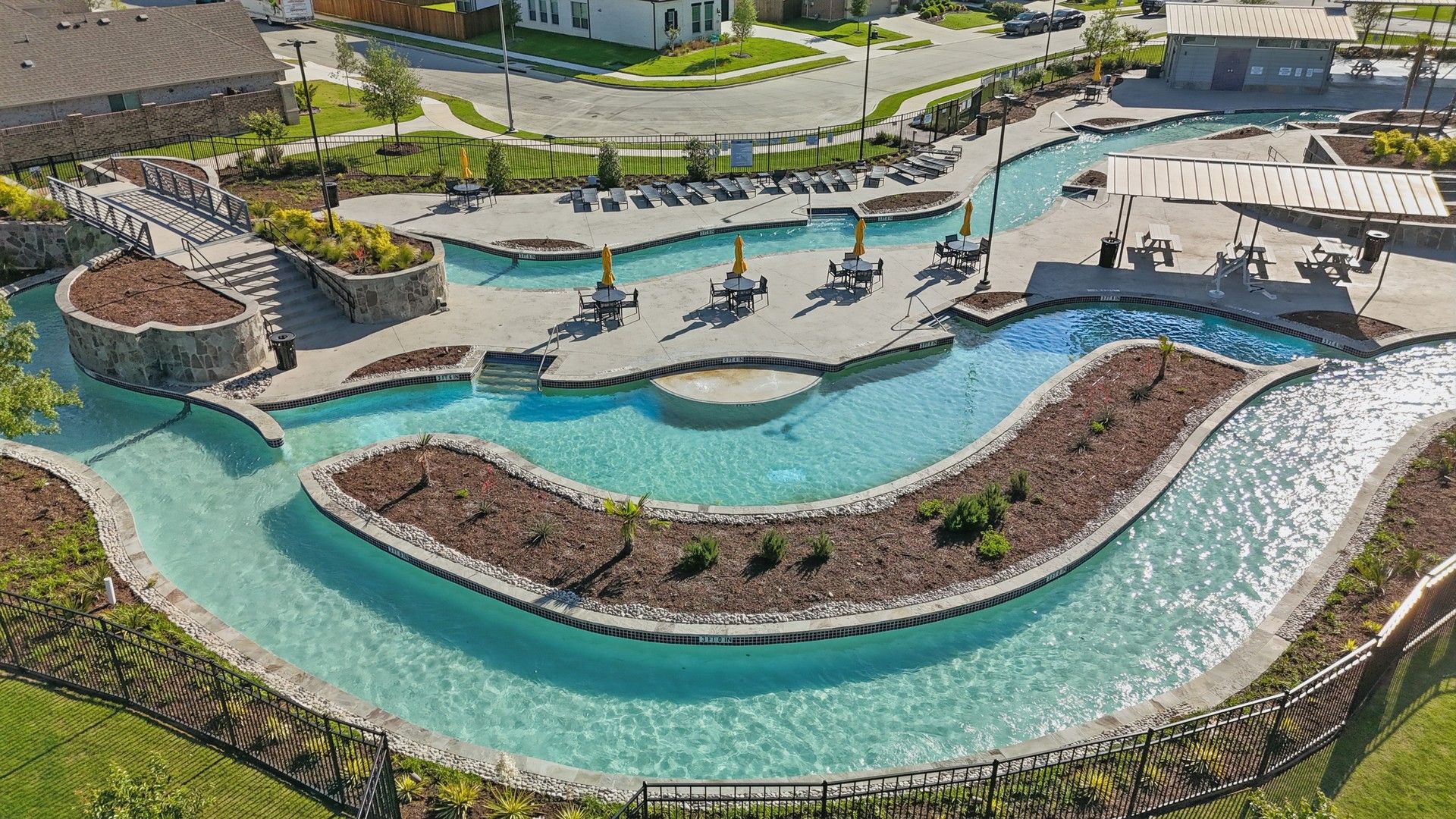 Experience tranquility in the elegant stone-bordered lazy river at Wildflower Ranch, Texas.