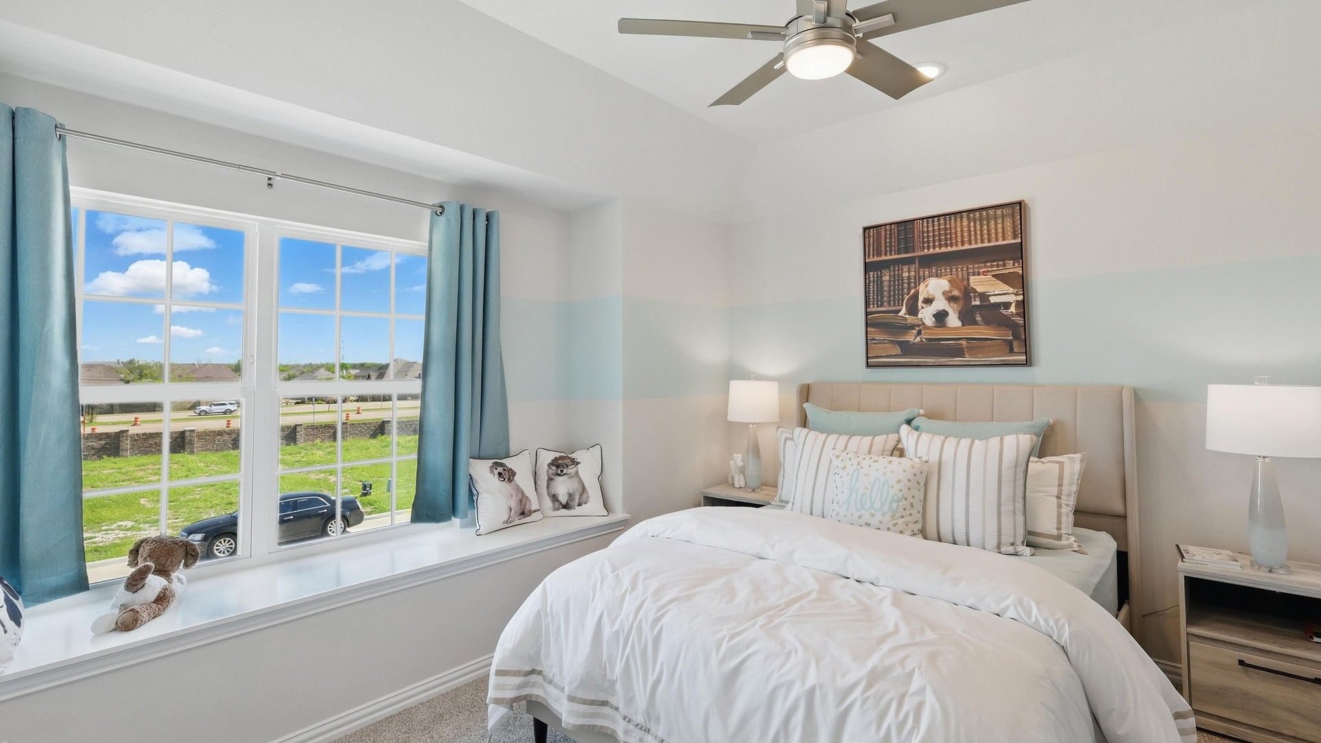 Sophisticated bedroom boasts plush textures, expansive window, and tranquil views in Green Oaks Preserve.